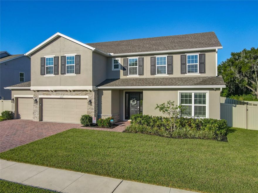 Welcome to this meticulously upgraded and stunning custom residence. Spanning approximately 3,900 square feet, this impressive home offers substantial space with five bedrooms, three full bathrooms, and one half bathroom.
The expansive main level features an open-concept living area. The Gourmet Kitchen is a chef's delight, complete with additional custom cabinetry, a Natural Gas Cooktop, Double Oven, Stainless Steel GE Dishwasher, and an elegant Farmhouse Sink. The kitchen, dinette, and Great Room flow seamlessly, creating an ideal setting for family life and entertaining. The well-designed floor plan also includes a separate downstairs office/den and a formal Dining Room. New Custom French Doors provide direct access to the rear lanai and oversized backyard.
Flooring throughout the main level is the durable and attractive Mohawk Revwood Plus laminate, which is both waterproof and steam-proof and extends up the staircase. The upstairs features a spacious second family room/playroom, five generously sized bedrooms, and three full bathrooms, including a convenient Jack-and-Jill bath. The Primary Suite serves as a private retreat, offering a spacious bedroom with an integrated sitting area and a spa-like ensuite bathroom.
Additional premium amenities include whole house quartz countertops, upgraded stain resistant carpet in the bedrooms, Plantation Shutters downstairs, a large four-car garage with new epoxy flooring, built-in cabinetry, and ceiling storage racks in the garage. The property is also generator-ready, with a natural gas stub located on the side of the house, and Security cameras have been installed around the perimeter of the home, providing full exterior coverage and peace of mind.  Enjoy all of these tasteful improvements without the inconvenience of new construction or renovations.
A comprehensive feature list is attached for your review.