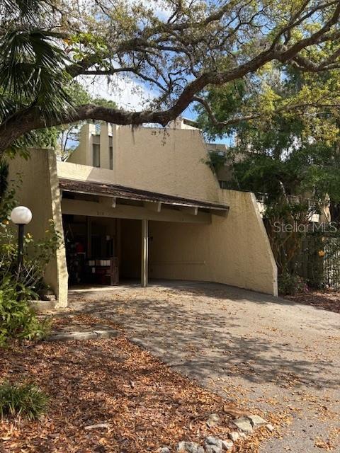This tranquil condo is located in The Springs, a nature preserve with access to a private section of Wekiva Springs where you can swim, paddleboard, canoe, lay out on the sandy beach and enjoy a beautiful sunny Florida day. This 2-bedroom, 2-bathroom end unit, also features an upstairs loft that is perfect for an office or workout room. Upon entering, you are welcomed with vaulted, cedar wood beam ceilings, in the expansive family room that includes a cozy, wood-burning fireplace. The kitchen offers an eat-in space and a breakfast bar that is located next to the family room, which is perfect for entertaining! The spacious primary bedroom features a walk-in closet and dual sinks with tons of vanity space. Walk out to the backyard balcony, that overlooks a nature preserve, from both bedrooms. This property has a total of 3 balconies, two of which are located off the main living room and a kitchen that boasts tons of natural light and a scenic view from every angle, you truly feel as though you are in a tree house. The association dues include water, sewer, lawn care, trash, outside pest control, roof, exterior, common areas, balcony decking and gutters. The community has a 24-hour manned guard gate, access to a private Springs, multiple community pools, walking/jogging trails, natural water streams, sandy beach, tennis/pickleball & basketball courts, clubhouse, playground, a picnic area that also offers BBQ grills. There are even Horse stables and boat storage which are available for an additional fee. The location is fantastic, you feel as though you are out in the woods yet just a mile from I-4 and minutes to shopping, dining and entertainment. With an acceptable offer, seller will contribute $5000 towards buyer's concessions-use the credit towards closing cost, prepaids, or upgrades of your choice. Schedule a tour today.