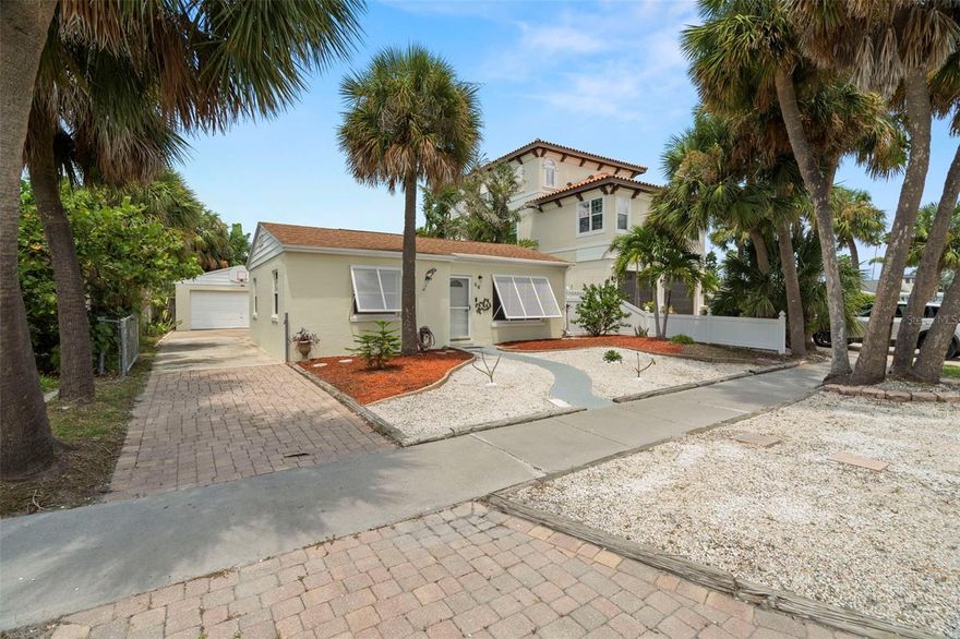Welcome to Clearwater Beach—consistently ranked among one of the top Beaches in the World! Imagine waking up each day just a short stroll from the soft, white powdery sand and turquoise Gulf waters. This adorable coastal retreat captures the true essence of beach living.  Featuring 2 Bedrooms, 1.5 Baths, Bonus Room, Screened Lanai, 2 Garage and Oversized Carport. Thoughtfully remodeled and remediated immediately after the storm, this home shines with updates including new hardie board decorative wall panels, hurricane-impact windows, new doors, cabinets, appliances, tile flooring, and a tankless electric water heater, A/C, electrical panel and more. Tile flooring throughout keeps things cool and easy to maintain—no carpet here! Natural Gas is also available! Relax on the inviting large screened-in porch, the perfect spot to sip your morning coffee or unwind after a day in the sun. The oversized carport and detached two-car garage provide plenty of space for cars, beach gear, or even a golf cart. There’s also a versatile bonus room ideal for a TV room or home office. The property is fully fenced with a gated driveway- perfect for privacy, pets, or simply enjoying your own private slice of paradise. Every improvement was properly permitted, giving peace of mind to the lucky new owner. This is the Clearwater Beach lifestyle you’ve been dreaming of—walk to the sand, local cafés, and vibrant beachside restaurants. Your beach haven is waiting!