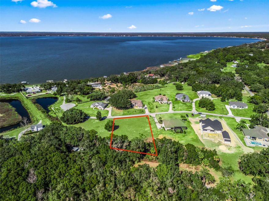 Beautiful 1.4 acre homesite in Orangewood Shores, a gated community, offering HOA access to Lake Weir via a community dock with one assigned boat slip space to each owner. Property requires installation of well and septic. HOA dues are $800 annually. Enjoy lake living, privacy, and endless possibilities in Weirsdale.