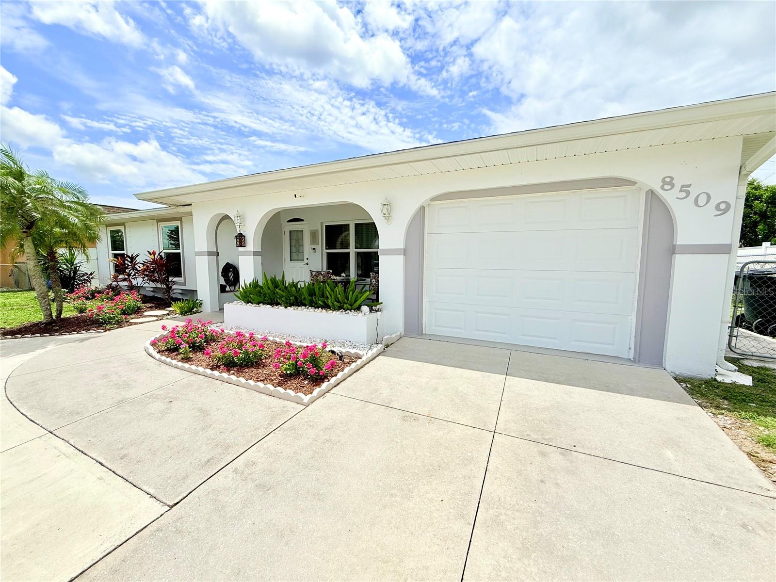 **Welcome to Your Dream Home!** Step into this freshly remodeled modern oasis, where contemporary design meets Florida charm. This stunning 3-bedroom, 2-bathroom residence is a true gem that embodies the essence of relaxed living, just moments away from the beautiful Gulf Coast. As you enter, you'll be captivated by the spacious open layout that seamlessly flows from room to room. The heart of the home is a beautifully redesigned kitchen that has been relocated to the lanai, creating a bright and airy space ideal for culinary adventures. Imagine cooking while basking in sunlight streaming through large windows that overlook your private backyard oasis. The living areas are thoughtfully designed to maximize space and functionality. One unique feature is the converted one-car garage, now a stylish office with its own separate entrance—perfect for working from home or as a private retreat. Should your needs change, this versatile space can easily be transformed into an additional separate bedroom. Step outside to discover your personal paradise! The fenced backyard features a charming patio area that's perfect for outdoor dining or simply soaking up the sun. With hurricane windows installed for added peace of mind, you can enjoy Florida's beautiful weather all year round without worry. With great location, NO HOA and NO CDD fees, this property offers incredible convenience with numerous dining options and shopping centers just moments away. ATTENTION TO INVESTORS: this home presents huge potential due to its proximity to Warm Mineral Springs Park - an attraction known for its therapeutic waters - and its suitability for year-round rentals. This home truly encapsulates Florida-style living at its finest! Don’t miss out on making it yours! Schedule your private showing today and experience firsthand what makes this property so special.