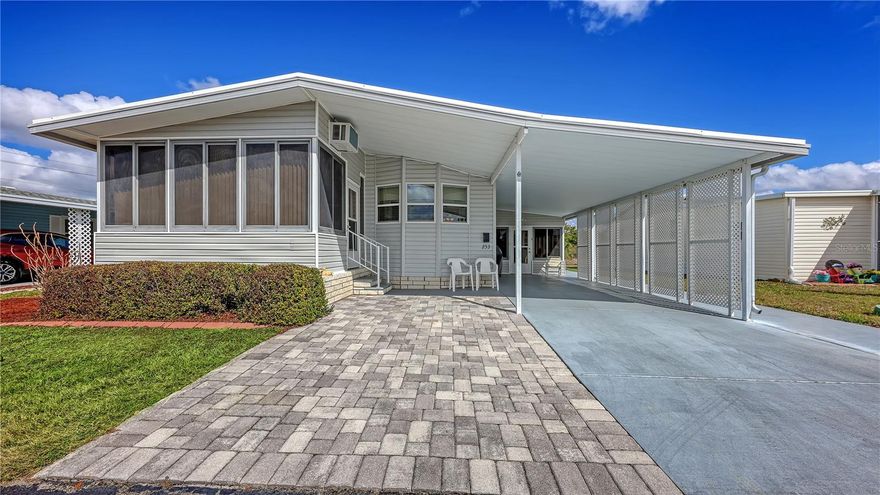 Highly sought after Gold Tree Co-op with over 295 homes is a 5 Star, over 55+ community. Light and Bright, this 2 Bedroom, 2 Bath home beams with pride of ownership. Immaculately clean, open and spacious and turnkey furnished. Engineered hardwood floors in the Living Room, Dining Room, Bedrooms and Hallway. Ceramic tile in the rest of the home, Kitchen, Bathrooms, Laundry and Florida Room. Formal Living Room and separate Dining Room, great for entertaining or just relaxing at home. Windows galore with plenty of natural light in the spacious Southern facing Kitchen. Newer appliances with a Breakfast Bar to Boot. Primary Bedroom has a walk-in closet, spacious En-Suite Bath with walk-in shower. Not one but two Florida Rooms for your relaxing pleasure. Separate inside Laundry Room with newer Washer and Dryer are included. All maintenance and updating/remodeling have been completed. From the membrane Roof (Lifetime Warranty), all polybutylene pipes were removed from home and replaced with PVC along with a new hot water heater in 2024. Crawl space, vapor barrier and 16 new tie downs inspected and installed March 2026. Brick Paver Golf Cart Driveway/Parking Pad 2010. Separate Shed behind Carport has plenty of space for storage and includes a Handyman's Dream Work Bench. Never a dull moment with the amenities and activities held at the remodeled Clubhouse/ Rec Center, heated pool & Spa, Tennis, Pickleball and Shuffleboard courts. All for a low monthly fee. Convenient location close to the UTC Mall, Benderson Rowing Venue, Sarasota Airport and local Beaches.