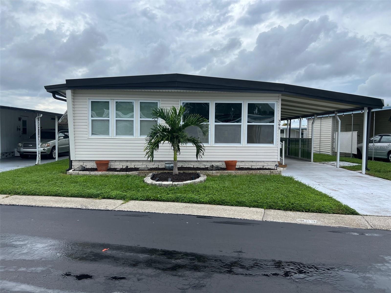 This one is a true head-turner! This two-bedroom, two-bathroom gem in Four Seasons Estates, a 55+ community, possesses an impressive 1,224 square feet! Just two miles from the sparkling Gulf of Mexico beaches and suitably close to churches, restaurants, sports, entertainment, and shopping, the location couldn’t be more ideal. With a remarkably low maintenance fee of only $285.00 per month(one of the lowest in Pinellas County), which includes water, sewer, garbage, and lawn, you’ll also enjoy access to fantastic community perks, including a heated pool, peaceful lakeside fishing, a lively clubhouse, shuffleboard, and so much more!
INTERIOR:
This wonderfully arranged home comes fully furnished and ready for immediate enjoyment, with thoughtful updates throughout, including, new cathedral doors and updated windows that allow natural light to pour in, while a mix of soft colored drywall and paneling creates character. Central heat and air that was replaced in 2022 for year-round comfort, ceiling fans circulate the air with ease, and laminate flooring throughout the majority of the home combine for a comfortable home. The kitchen is a dream, showcasing vinyl plank flooring, brand-new countertops, newer appliances, a stainless steel refrigerator, cooktop, wall oven, range oven, microwave, and the convenience of a dishwasher and ice maker, plus a stackable washer and dryer neatly tucked behind closed doors. In addition, the breakfast bar provides space for two stools, offering the perfect spot for a quick snack or casual conversation. The layout is impressively spacious, with two versatile open areas—one easily serving as a third bedroom or den complete with air conditioning and a stylish barn door for privacy, and the other functioning as a delightful sitting area that seems tailor-made for curling up with a book you just cannot put down or sipping your morning coffee or evening tea. The dining room enhances the home’s appeal even further with room for a substantial table while presenting a built-in buffet, with a pretty backsplash/countertop, and cabinets to store or display so many items. On to the attractive living room with stylish furnishings and window coverings, perfect for movie night or entertainment. A considerable primary bedroom shows a walk-in closet with an ensuite bath featuring porcelain tile flooring, double vanity and a walk-in shower. The delightful guest bedroom appears to be waiting for its next visitor! Ready to provide storage with an ample closet. This room utilizes the hall bath, featuring porcelain tile flooring, lots of storage and a tub/shower combination
EXTERIOR:
This well-maintained home features durable vinyl siding, a carport, and a roof-over completed in 2022 for enhanced protection. A separate shed offers storage space for lawn equipment, seasonal belongings, and additional items. The outdoor seating area, equipped with a television, provides an ideal setting for viewing sporting events with your favorite friends! Listed at $169,900, this attractive property includes a share, making it a remarkable combination of style and value. The offering stands out for its competitive price point, array of amenities, updates, and its prime location!