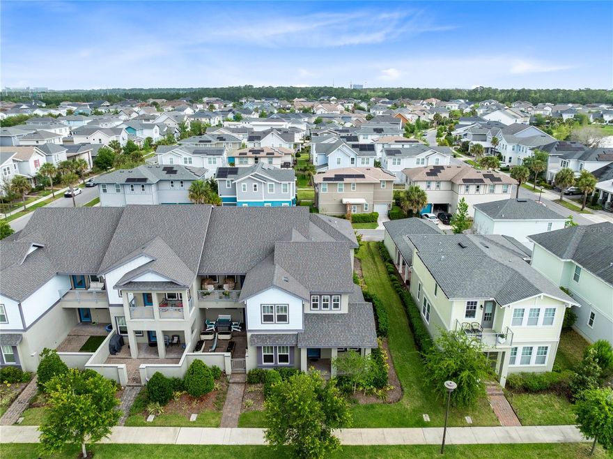Welcome to this beautifully maintained corner unit townhome in Laureate Park, offering 3 bedrooms, 2.5 bathrooms, a spacious loft, and nearly 1,945 square feet of thoughtfully designed living space. Built by Craft Homes, this Bower model is set on a premium end unit lot among million dollar homes and stands out with charming curb appeal, lush landscaping, a covered front porch, and beautiful green space right out front. Inside, the open concept layout feels bright and inviting with abundant natural light, neutral finishes, and spacious living and dining areas that flow seamlessly together for everyday living and easy entertaining. The kitchen is both stylish and functional, featuring granite countertops, stainless steel appliances, white cabinetry, a large breakfast bar, and generous prep and storage space. Just off the kitchen and dining area, the private paver patio offers a great spot for outdoor seating, grilling, or enjoying Florida living. Tucked away on the first floor, the primary suite offers the comfort and convenience of main level living, with a spacious bedroom, large walk in closet, and private bath complete with dual sinks, a long granite vanity, and a walk in shower. A guest half bath is also located downstairs. Upstairs, the large loft creates a true flex space that works beautifully as a second living area, media room, home office, or study zone, while two additional bedrooms, a full bath, and a separate laundry room complete the second floor. With its corner location, open views of the green space, nearby community mailbox, convenient parking right out front, and close proximity to the lake, this home offers a rare blend of privacy, comfort, and everyday convenience. Laureate Park isn’t just a neighborhood, it’s a vibrant lifestyle. Enjoy the Aquatic Center, resort style pools, LP Fit gym, and 44+ miles of trails. Located in prime Lake Nona, minutes from Medical City, the VA hospital, Nemours, dining, and shopping. Close to major highways, Orlando International Airport, and the USTA National Campus. Easy access to Orlando’s top theme parks and beautiful Florida beaches. This home blends space, comfort, and community in a sought after location. Experience elevated living, schedule your private tour today!