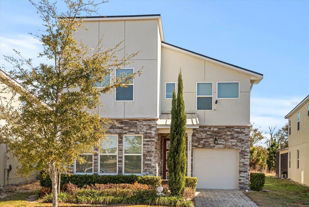 Photo of 2009 Tropical Palms Circle, Kissimmee, FL 34747 (MLS # O6380337)