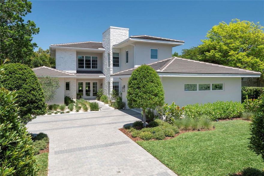 Welcome to a one-of-a-kind, custom-designed residence offering the perfect blend of modern sophistication, thoughtful functionality, and resort-style amenities. Designed by Origins Residential Design and meticulously constructed by Native Homes, this 5-bedroom, 5.5-bathroom showplace is located in one of Winter Park’s most sought-after neighborhoods—just minutes from Park Avenue, Baldwin Park, and top-rated schools.

This exceptional home was built in 2019 and features a flexible, open-concept layout that exudes comfort and luxury. The spacious main living areas are drenched in natural light and designed for seamless entertaining and everyday ease. The split-bedroom floorplan offers five generously sized en-suite bedrooms, each with its own private bath—no shared walls between any bedrooms ensure total peace and privacy for all. Two bedrooms are located on the first floor, including the lavish downstairs primary suite with a spa-inspired bathroom featuring a soaking tub, oversized dual vanities, frameless glass shower, and an enormous custom-designed walk-in closet.

The heart of the home is the chef’s dream kitchen, masterfully laid out with distinct zones for cooking and gathering. Highlights include a gas cooktop, Thermador appliances, huge quartz-topped island, 42” cabinets, a cozy coffee and juicing nook, an oversized walk-in pantry, and a striking design that marries stainless steel with warm brass accents. Just off the kitchen, a separate beverage zone includes a built-in wine fridge, making entertaining effortless.

No detail has been overlooked—from the White Oak hardwood flooring and marble inlay floors, to the suspended ceilings, solid Shaker-style interior doors, 7” milled baseboards, and designer light fixtures throughout. Modern conveniences include pre-wired surround sound, recessed lighting, dimmable lighting with frameless switch plates, custom framed mirrors, new Kohler bath fixtures, and a whole-house water filtration system. Restoration Hardware sheer drapes ($20K), remote-operated Shade Store treatments

Enjoy seamless indoor-outdoor living in the resort-style backyard retreat. The ultra high-end, zero-edge saltwater pool and spa feature Aqua Pearl interior finish, glass mosaics, and are fully smartphone-controlled, including lighting, jets, and both gas spa and pool heaters. Entertain under the covered outdoor patio complete with an Artisan grill, new neutral-toned accent walls, and outdoor kitchen—all surrounded by sandblasted Carrara marble pavers, remote-controlled vanishing screens, and a full privacy fence with Podocarpus hedge. Extensive professional landscaping includes fresh sod, tilled and leveled topsoil, blooming flower bushes, and river rock side paths. The backyard also features new turf, a dedicated dog run, and completely upgraded irrigation for optimal efficiency.

Oversized 2-car garage, tile roof, gutter guards, security system with cameras, new washer/dryer, and professional landscaping with upgraded irrigation. Quiet zone near hospitals, attracting medical professionals. Electrical lines to be buried within few months and very strong internet.

Minutes to Baldwin Park, Park Avenue, restaurants, shopping, Wellness Center, and scenic trails. Zoned for top-rated Winter Park schools (Brookshire, Glenridge, Winter Park High) and near private schools- Lake Highland Prep, Park Maitland, Geneva School and more