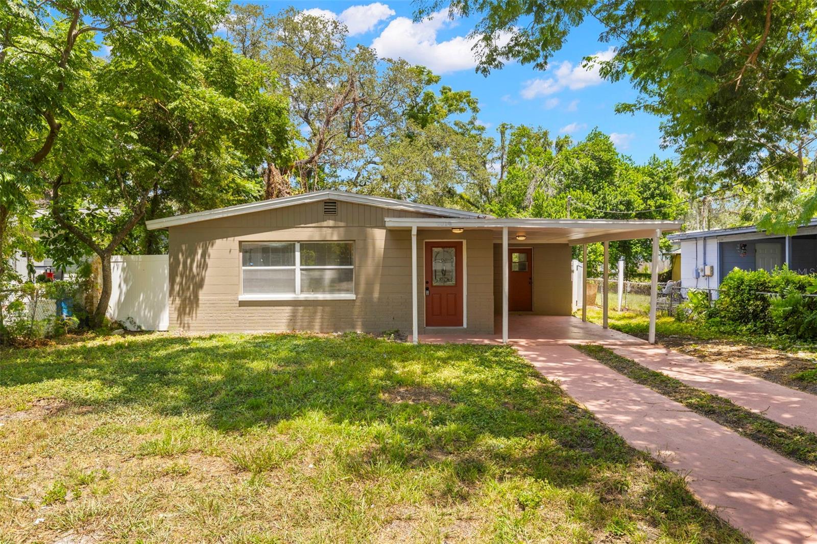 You’re going to fall in love with this charming home, surrounded by lush, mature trees! Recently and beautifully updated, this light-filled home features all hard-surface flooring and a comfortable, spacious layout. Enjoy 3 inviting bedrooms and 1 stylishly remodeled bathroom.
The large, fully fenced backyard is perfect for a playground, pets, or creating your dream garden retreat. Additional perks include a sheltered driveway plus a built-in utility and storage room for extra convenience.
All of this in an unbeatable location close to everything you need. Don’t miss your chance to make this special property your new home!