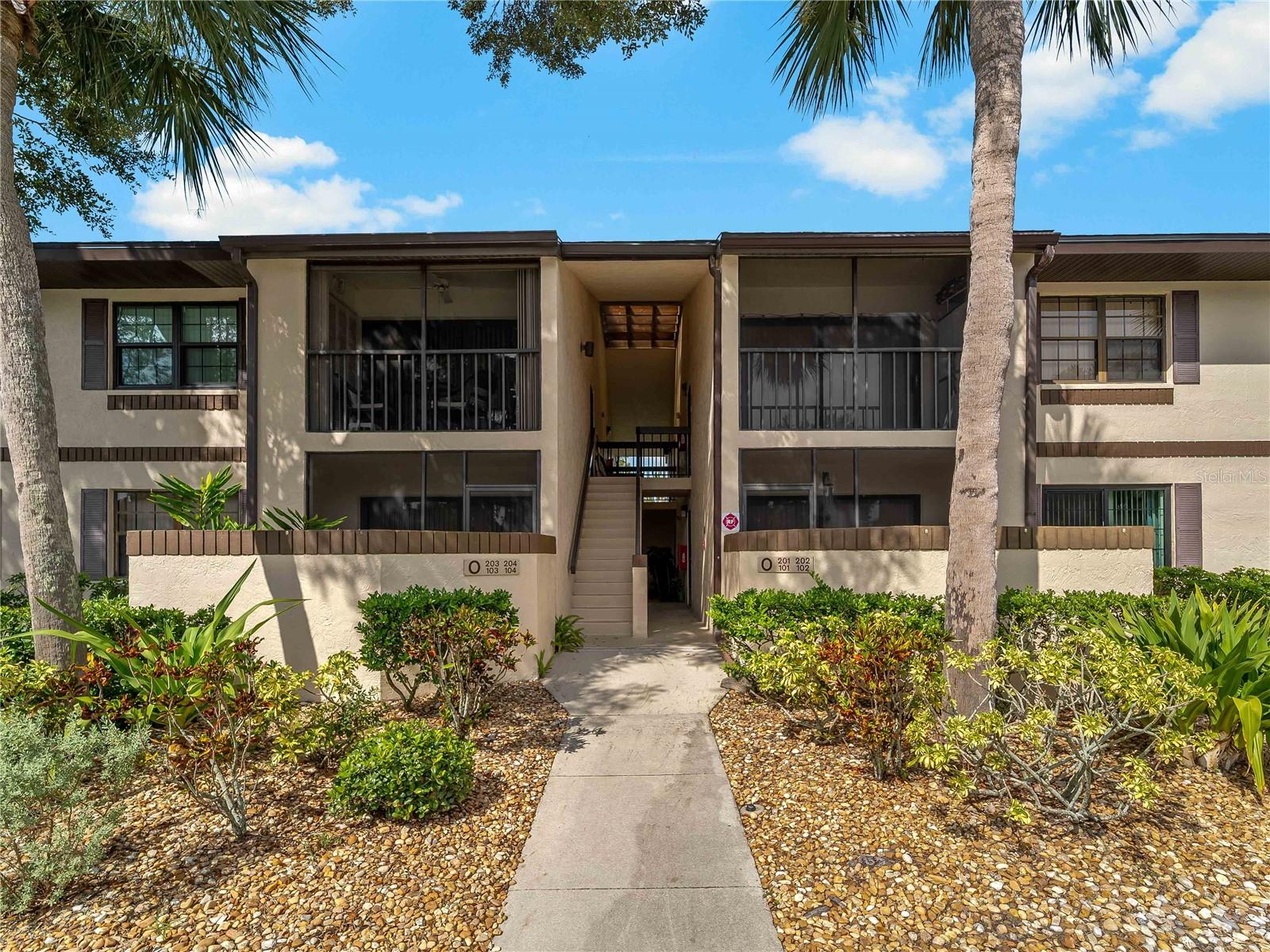 Charming 2 Bedroom / 2 Bathroom Second-Floor Condo in the Oaks Condominium community! This inviting unit features luxury vinyl plank flooring throughout. A well-appointed kitchen with stainless steel appliances, granite countertops, ample cabinet space, a breakfast bar, and a convenient pass-through to the dining room. The adjacent dining area is perfect for everyday meals or entertaining. Enjoy the cozy family room with direct access to a private balcony. The spacious primary bedroom suite includes a large closet, with updated bathroom for added convenience. Located in a beautiful, wooded community with a canal and pond. The property features fantastic amenities, including a clubhouse, saltwater pool, bocce and shuffleboard courts and a dog park. Ideally situated near shopping, dining, services, and transportation.