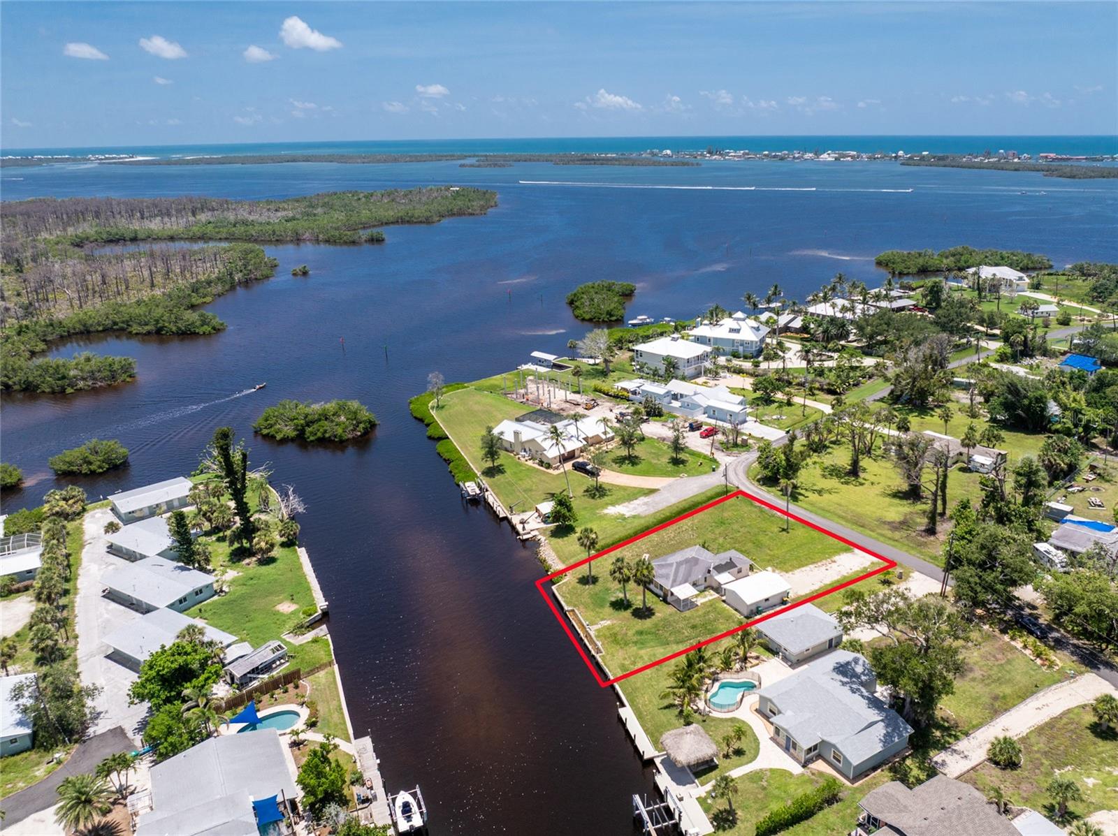 Waterfront Canal Property with No Bridges to the Gulf! Welcome to this rare opportunity in Englewood. This oversized one-third acre lot sits on a deep water canal with direct access to Lemon Bay and the Gulf of America, with no bridges to slow you down. The existing 1,200 square foot block home was flood-damaged and could be renovated if you're up for a project, or cleared to make way for the custom coastal home you've been dreaming of. There’s also a 416 square foot detached block garage that is in salvageable condition and could be a great starting point. The property is being sold for land value and includes a concrete seawall already in place, with plenty of space to create something special. Tucked in a quiet neighborhood less than three miles from Englewood Beach, this location offers easy access to local restaurants, tiki bars, boat ramps, kayak launches, and some of the area’s best fishing all just a short drive away. For those who love to stay active, this location is just minutes from the expansive Ann and Chuck Dever Regional Park, featuring over 300 acres of outdoor recreation. Enjoy access to a heated competition pool, fitness center, multi-purpose gym, and a community garden. You’re also close to the scenic Oyster Creek Waterfront Trail, which links to Cedar Point Environmental Park, perfect for nature walks and wildlife viewing. Golf courses, pickleball and tennis courts, and additional parks are all conveniently nearby. Whether you're planning to build new, restore what’s here, or invest in a valuable piece of waterfront land, this property offers endless potential. Don’t miss your chance to view 1899 Riverside Drive in Englewood, schedule a private showing today.