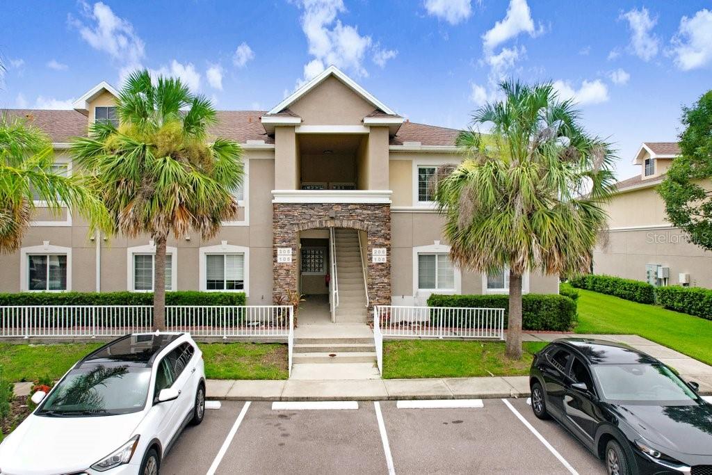 Experience upscale, low-maintenance living in this beautifully designed Club Villa floor plan condo located in Anand Vihar, Tampa Bay’s premier 55+ luxury community in Wesley Chapel, FL. Built with modern comfort and elegance in mind, this home boasts high-end finishes including quartz or granite countertops, 42” soft-close cabinetry, GE Profile stainless steel appliances, upgraded flooring, and detailed crown molding throughout. Anand Vihar is more than just a place to live—it's a lifestyle. Enjoy a vibrant and serene atmosphere with resort-style amenities such as scenic walking trails, a state-of-the-art fitness center, steam rooms, a sparkling pool and spa, yoga/meditation/prayer room, movie theater, and a luxurious clubhouse. The community also features a dining hall serving fresh, chef-prepared vegetarian cuisine inspired by the diverse regions of India—allowing residents to truly embrace maintenance-free living with no need to cook. This thoughtfully designed and culturally enriched community continues to be one of the most sought-after in the area. Schedule your private tour today and discover the elevated lifestyle that awaits at Anand Vihar.