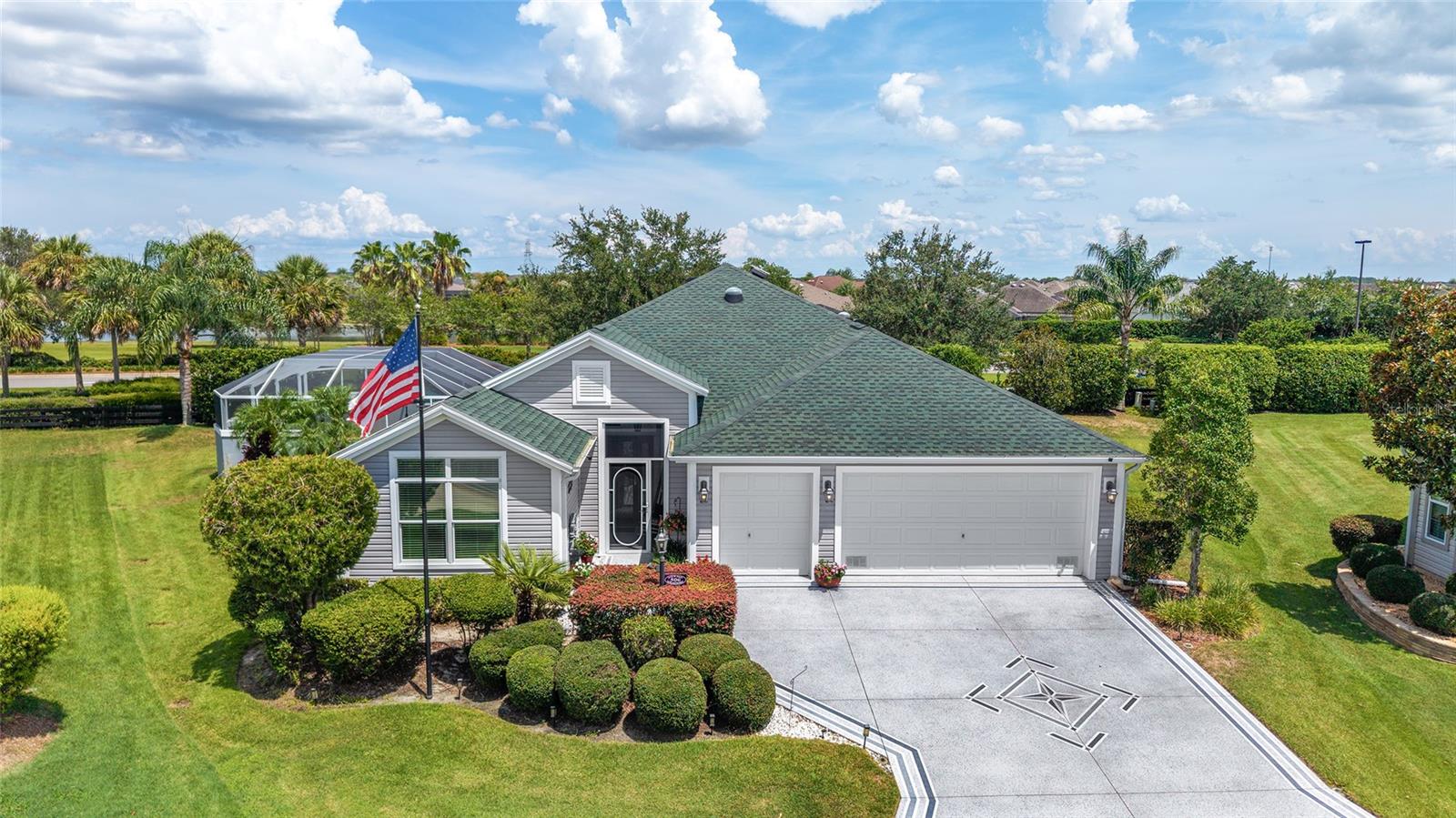 Beautiful Pool Home in the sought after Village of Charlotte. This area is frequently referred to as the new center of The Villages. This home checks all the boxes. Let's start with the lot which is at the end of a quiet cup-de-sac. Notice the artistic epoxy driveway/walk and mature landscaping. Entering the house prepare to be wowed. Newly painted walls, high ceilings, solar tubes and tile floors create a bright and welcoming space. The kitchen area is sure to impress with white cabinets, custom lighting, center island and lots of storage. The versatile pony bar is great for eating, serving or chatting with the chef. This kitchen also includes a generous breakfast nook with a window for lots of natural light. The dining room and living room are equally generous with endless layout options. The primary suite is located in the back corner of the home for maximum privacy. This suite includes dual walk-in custom closets and a gorgeous bath with two sinks, a walk-in Roman style shower and private commode. Bedrooms two and three are located in the front corner of the house and includes a pocket door for guest privacy. Both guest bedrooms have large closets and also share a second full bathroom. Saving the best for last it's time to step out onto the oversized lanai with custom cabinet storage, electric privacy screens and large screen TV. Walking down to the pool area you are sure to be impressed. Whether you are sunning, splashing, floating or just relaxing, it doesn't get better than this. A few other features worth noting include indoor laundry with utility sink, oversized garage with golf cart garage, storage cabinets, shelving, attic stair, epoxy floor, insulated doors and insulated ceiling, gutter and downspouts on entire house, flag pole, storm door and ceiling fans. New Roof in 2023, New HVAC in 2024, new washer/dryer in 2023. Please take a look at the photos, watch the professional video and call for a private showing.