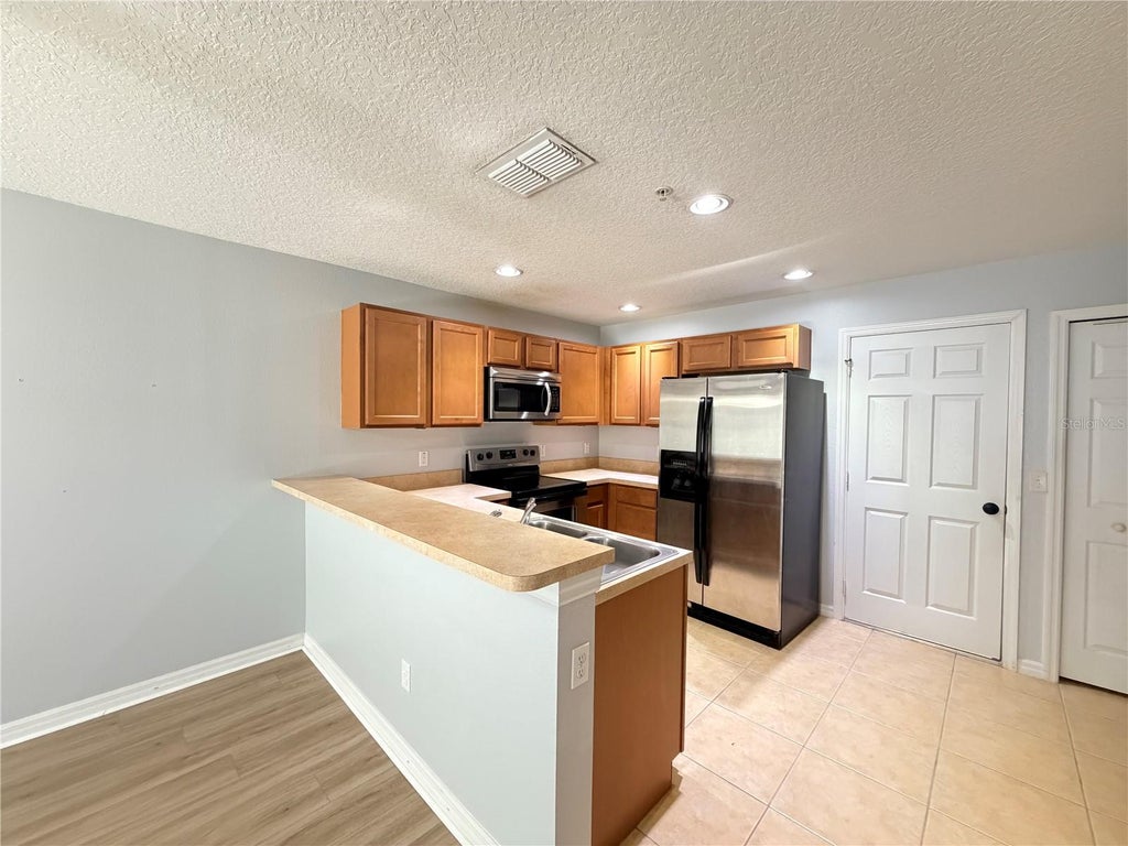Photo of 290 Glowing Peace Lane #52, Orlando, FL 32824 (MLS # O6422914)