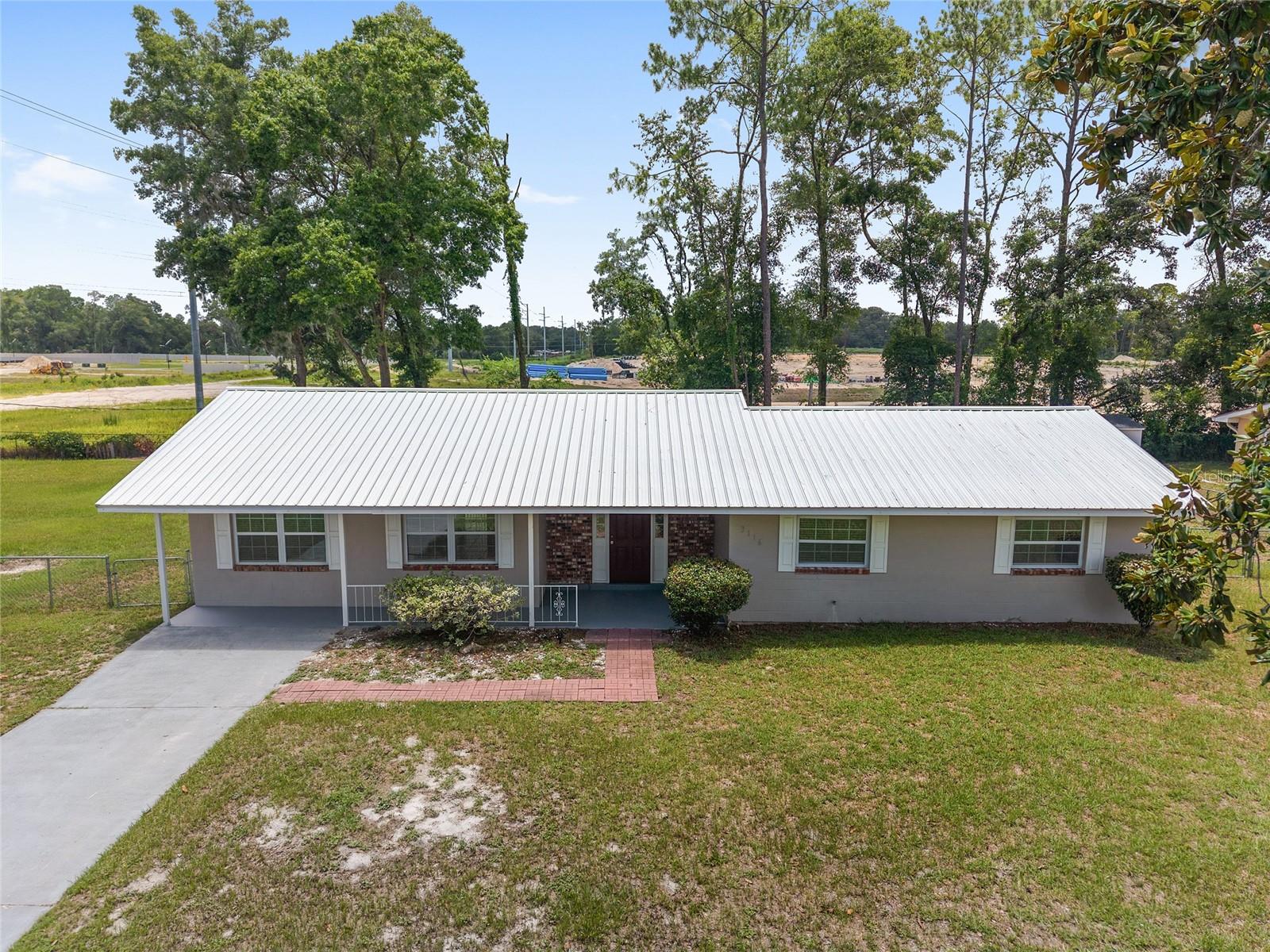 Welcome Home. Nicely Remodeled & Updated 3 bedroom 2 Full bath Concrete Block Home with 1,354 living sq ft & 1,736 sq ft under roof, Large living room, Bonus room/office, Fully chain link fenced back yard with a storage shed on over HALF ACRE (0.59 acres) on a dead end street in Sunray Estates. Freshly painted front porch floor. Newer Metal Roof & AC in 2022, Newer windows throughout, Tile flooring, painted interior, Upgraded Custom Blinds, Modern kitchen with ceramic tile backsplash, Side by side fridge, Overhead microwave, Flat top range, Dishwasher, & Pantry. Ceiling fans & Newer 6 panel doors throughout. Upgraded Crown Molding, Inside laundry room with cabinets & countertop space. Front & Backyard Covered Patio. Only minutes away from downtown, amenities, shopping & dining. Request your showing today. One pet allowed with some restrictions and cannot be on any dangerous breed list. $250 pet deposit, $250 pet fee, and $100 pet approval fee required. Serious inquiries only. $60.00 application fee for first adult and $40.00 application fee for every additional adult. Must show total household gross income of $4,935 per month. 1st, last, and security deposit required. $1,645x3 = $4,935. Must carry renter's insurance. NO SMOKING. Don't miss your chance to see this property and schedule your showing today before it's gone!