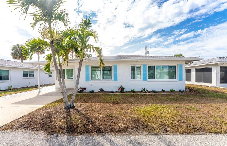 One or more photo(s) has been virtually staged. Fully updated free-standing 2 Bed/ 2 Bath villa in Englewood Beach Condo Association, a charming 55+, gated community.  Comprised of 99 units, this idyllic retreat is nestled in the heart of Manasota Key, just a stone's throw from Englewood Beach and island restaurants and shopping. This villa features an updated kitchen with beautiful tile backsplash and quartz countertops with a breakfast bar that flows seamlessly to the air-conditioned Florida room, the den/flex room, and interior laundry room. The oversized (15’ x 23’) living room is perfect for relaxing or entertaining guests. The primary bedroom includes an updated en-suite bathroom with walk-in shower and built-in bench. The guest bathroom has also been updated. Outside, the extended brick paver patio area with retractable awning is perfect for lounging, dining and/or entertaining. There is also an enclosed outdoor shower to rinse off from the beach and a widened parking pad, which allows parking for two smaller cars. Impact-resistant windows and exterior doors throughout the home and Bahama shutters in most windows add a nice beachy ambiance. Take a stroll over to the community clubhouse, where you’ll find plenty of social activities happening throughout most of the year. Additionally, the community boasts one of the largest heated pools on Manasota Key. The Community’s maintenance fee covers lawn maintenance, water/sewer, trash removal, recreational facilities, private roads, exterior maintenance (roof, paint, etc.), public insurances, and a community manager. Don't miss your opportunity to live in this unique, sought-after community!