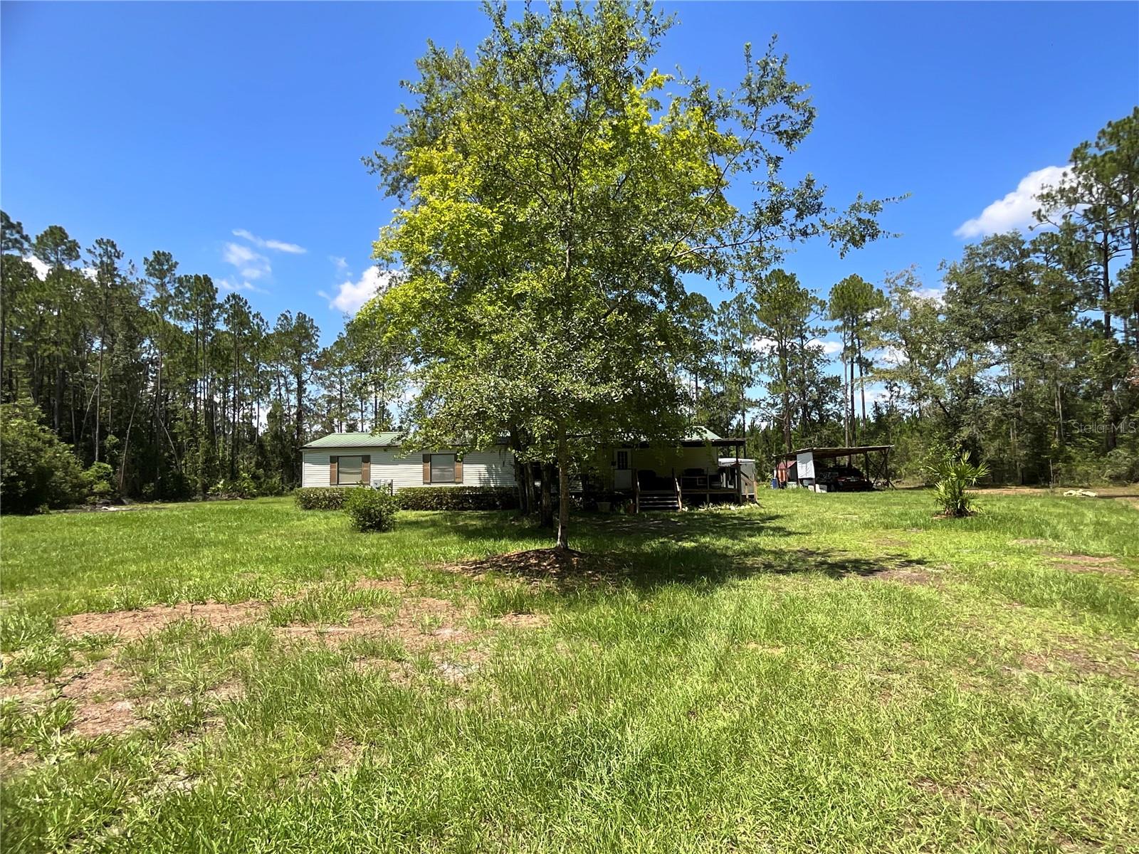 4-Bedroom, 2-Bath Manufactured Home on 3.5 Acres in Fort McCoy, FL
Motivated seller!
Enjoy peaceful country living with this well-maintained 4-bedroom, 2-bath mobile home situated on 3.5 acres in the heart of Fort McCoy. Surrounded by open farmland and natural beauty, this property offers privacy, space, and a serene setting.
The home has been well cared for and is move-in ready. The acreage provides plenty of room for gardening, animals, or simply enjoying the quiet outdoors. Wildlife is abundant, making this a perfect retreat for nature lovers.
Located in a beautiful area with many nearby farms and larger properties, the home offers a true country feel while still being within a short drive to Ocala and Gainesville, where shopping, dining, and entertainment are easily accessible.
If you’re looking for a peaceful property with room to grow, this Fort McCoy home is a wonderful opportunity.
Seller would possibly consider owner financing.