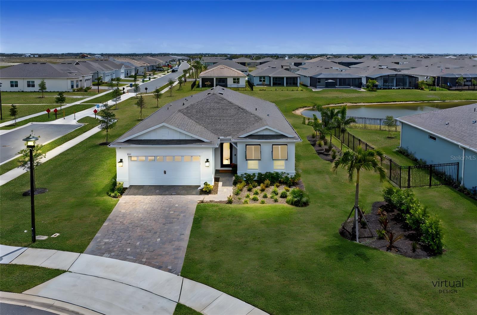 Skip the wait, skip the hassle—move right into this better-than-new home in Del Webb Viera, Brevard's most sought-after 55+ active lifestyle community. While new builds are still going up with tempting incentives, this rare resale offers something they can't: immediate enjoyment, extensive upgrades, and no construction delays or endless warranty repairs. This Extended Mystic floor plan sits on a prime oversized lakeview lot, perfectly positioned for watching rocket launches from liftoff to beyond. Inside, every detail is elevated: newly replaced dual glass hurricane impact windows throughout, extended-height solid kitchen cabinetry, custom lighting, and porcelain tile flooring. The gourmet kitchen flows effortlessly into the open living space, where quality ceiling speakers deliver surround sound to the living room, primary suite, and spa-like bath. The 3-car garage is wired with EV charging, paired with an upgraded HVAC filter system and a soft water system for maximum comfort.
Outside, enjoy the extended screened lanai-ideal for morning coffee or evening sunsets over the water. Del Webb Viera, every day feels like a vacation. With 15 sports courts, a zero-entry pool, clubs and activities for every interest, and the upcoming Catamaran Clubhouse featuring a tavern & grill, fitness center, outdoor spa, firepits, and more-you're buying more than a home, you're buying the lifestyle you've dreamed of.