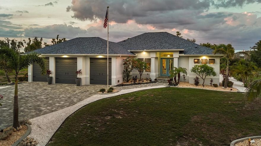 Built in 2019 this stunning 3 bed, plus den/study, 2 bath home sits on over half an acre of land, with a gorgeous heated pool and lanai and a car lover's dream 3 car garage. Located in the historic Vanderbilt developed neighborhood of Cape Haze with banyan lined streets, sidewalks to stroll to shopping and dining. Like all the homes in the neighborhood the house sits nicely back from the street, with a wide paver driveway and walkway up to the front door. Tall ceilings, large open kitchen and great room, custom wood cabinetry, stone counter tops, designer tile backsplash, high end appliances, plank tile flooring throughout, 8-foot zero corner sliding glass doors to the lanai, a full roll down screen and an outdoor kitchen on the lanai. Expansive paver lanai, beautifully designed pool with a sun shelf and in-pool seating. An incredible jumbo size 3 car garage with oversized stall doors, with two doors that are 9' wide by 10' tall and one 10'x10' middle door. Extra deep and tall ceilings, perfect for car lifts, storing boats, a workshop, and tremendous storage space. The home also comes with a very handy 10'x16' shed, perfect for even more storage. Cape Haze is a special waterfront community with membership in the Cape Haze POA there is usage of a dock and private beach on Don Pedro Island. A phenomenal location, Cape Haze is close to three full service marinas, numerous public and private golf courses, historic Boca Grande, miles of pristine sandy beaches and world-class fishing and boating.