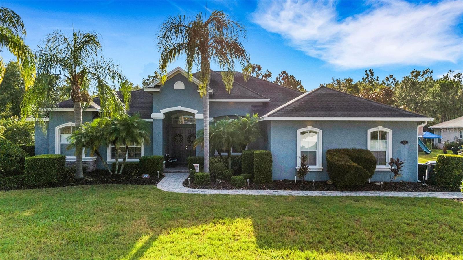 Introducing a stunning resort-style home built by Hulbert Homes, now available in the wonderful RiverLake neighborhood. This impressive property features 4 bedrooms plus a bonus room, ideal for an in-law suite, and offers an array of community amenities, including a gated entrance, subdivision clubhouse available for parites, tennis courts, pickleball courts, and a community dock. As you arrive, you’ll be greeted by a custom paver brick driveway leading to a spacious 3-car garage on a lot that is approximately half an acre, complete with a fenced backyard and plenty of outdoor space. The interior boasts an exceptional floor plan, with easy-care wood-look tile flooring throughout most areas. The kitchen features an eat-in space overlooking a beautiful chlorine-free pool and spa, complemented by a lovely paver tile deck, and flows into a large family room that also provides pool views. The master bedroom retreat includes a luxurious spa-like en-suite bathroom with dual vanities, a freestanding tub, and a separate shower, while the split bedroom layout is perfect for large families or entertaining guests. Additional highlights of this one-story home include spacious closets in every bedroom, custom tray ceilings with lighting, crown molding, stainless steel appliances, a removable pool safety fence, and many other quality features typical of a custom-built house. Don’t miss your chance to view this beautiful home—call your agent today to schedule a showing before it's sold! View a full video of this property