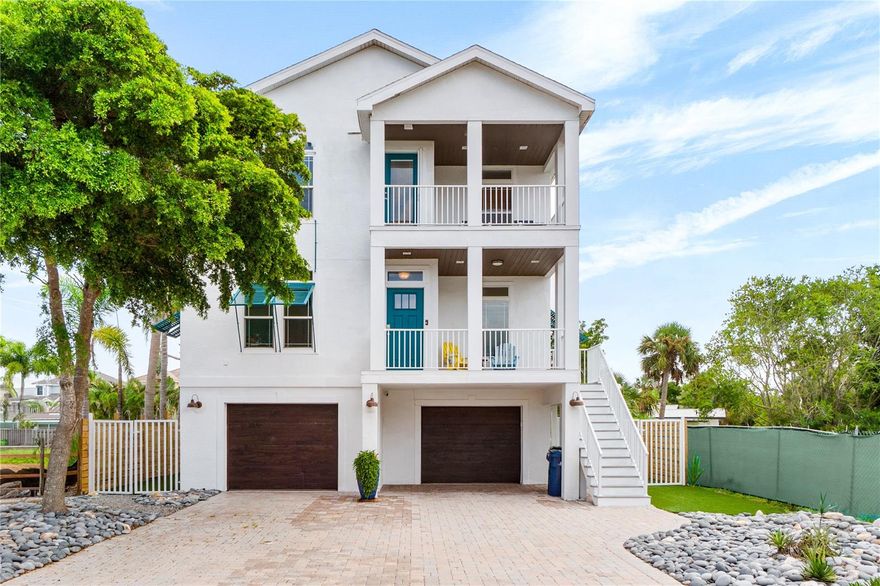 This newer construction home is perfect for year-round living or as a beach retreat.  Additionally, it has made nearly $100,000.00 in rental income.  Its design and amenities are exceptional as is it’s versatility!  The elevator extends from the street level 3+ car garages to the main living floor and the upper floor.  You are greeted on the main floor with a large living room opening to a main dining room.  The dining room extends to the large chef’s kitchen and its breakfast bar which easily seats 6 for casual dining.  This floor also contains one of the 2 primary suites toward the rear of the home with views of the backyard pool area.   The main level also has a large ½ bath and an additional family/entertainment room.  The primary suite is furnished with a king-size bed, a primary bath with dual vanities, water closet and extra-large shower.  Closet space was not spared and there is abundant storage as well.  The kitchen has a large walk-in pantry, upgraded appliances, soft close drawers and doors and plenty of storage.  The upper, 3rd level, has a large family room, a breakfast bar, mini fridge, microwave and plenty of counterspace and storage for long lazy nights in front of the tv or with a good book.  The laundry area is on this floor along with another primary suite, primary bath with a beautiful soaking tub, separate shower, water closet and walk-in closet as well as 2 additional large guest bedrooms and a full bath.  All this is wrapped with beautiful outdoor space, private balconies and porches on all living levels and a covered sitting area beside the sparkling heated pool.  If you prefer the beach, Siesta Key beach is a short 3 block walk, and the village is filled with wonderful restaurants, shops and all beach life’s necessities are all close at hand.  The Seller’s preference is to sell the home turnkey but if that isn’t your desire, they will accommodate the needs of the buyer.