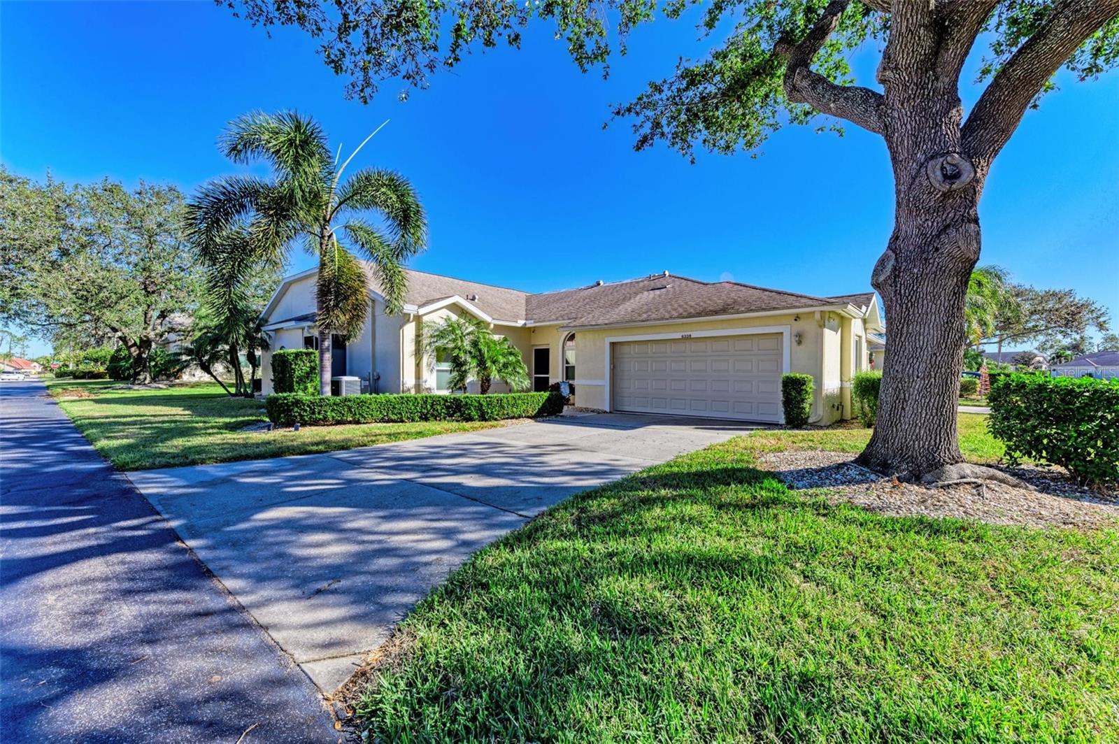 A must-see! Gorgeous TURNKEY FURNISHED villa with exquisite taste and a rare excellence in design in the maintenance-free community of Twelve Oaks II of Tara. Countless amenities and the ideal location mean this villa is the Florida lifestyle you have dreamed of finding. NEW ROOF just installed in March 2025. This turnkey move-in ready villa with a split floor plan provides 1,701 square feet of living space, two bedrooms, two baths, two car garage with shelving, a designated den/family room that could easily be transformed into a separate guest space, interior laundry room, Florida room, a screened lanai and includes a Class A golf membership. Tastefully designed and beautifully updated, you won’t have to do more than bring your clothes and toothbrush. All furniture and contents are included. When you first enter the home, you’ll be greeted by open living that welcomes you into the kitchen, dining and main living space. This villa’s open floor plan and spacious living area means you’ll never miss out on the conversation. The large updated kitchen is outfitted with stainless steel appliances, Corian counters, solid wood cabinets and drawers for an abundance of storage space and a breakfast nook area to drink your morning coffee. The dining, living area and Florida room all flow together, providing open living with all modern comforts of home. Strong natural lighting floods the living area while giving a heightened sense of space and airy ambiance. Plush sofas and a smart TV set the stage for family entertainment. The spacious primary bedroom includes an en-suite bath with walk-in closet, dual sinks and Roman walk-in shower. Off the living area, you’ll find the guest bedroom, bath and extra living space, providing privacy for family and visitors. Additionally, you will also find a quaint office/bonus room that allows for privacy for business or fun hobbies. Step through the extra-large sliding glass doors to enjoy the cool breeze on your screened patio while being surrounded by beautiful tropical landscaping. Twelve Oaks is a pet-friendly community allowing one pet and has no age restrictions. The community offers a lifestyle to enjoy every day, including access to golf, pickleball, tennis, bocce ball, yoga, water aerobics, resort-style heated pools, spa, fitness center, steam room, clubhouse events, dining, beverages, and snack bar, and numerous social activities. Tara Golf & Country Club Class A membership allows you to play unlimited golf for a monthly membership fee, plus a $60 monthly fee used toward a food minimum that will roll to the following month if not used. The condo fee covers the exterior maintenance, community pool and grounds. Tara Master Association includes Comcast high-speed internet and cable TV, HBO and DVR. Most convenient location for shopping, dining, Publix and banking you can access by golf cart. Public boat ramp close by Braden River, easy access to shopping, Interstate 75 and gulf beaches. Click on the 3D virtual tour link to virtually walk through the house. Make your appointment to view this amazing home today.