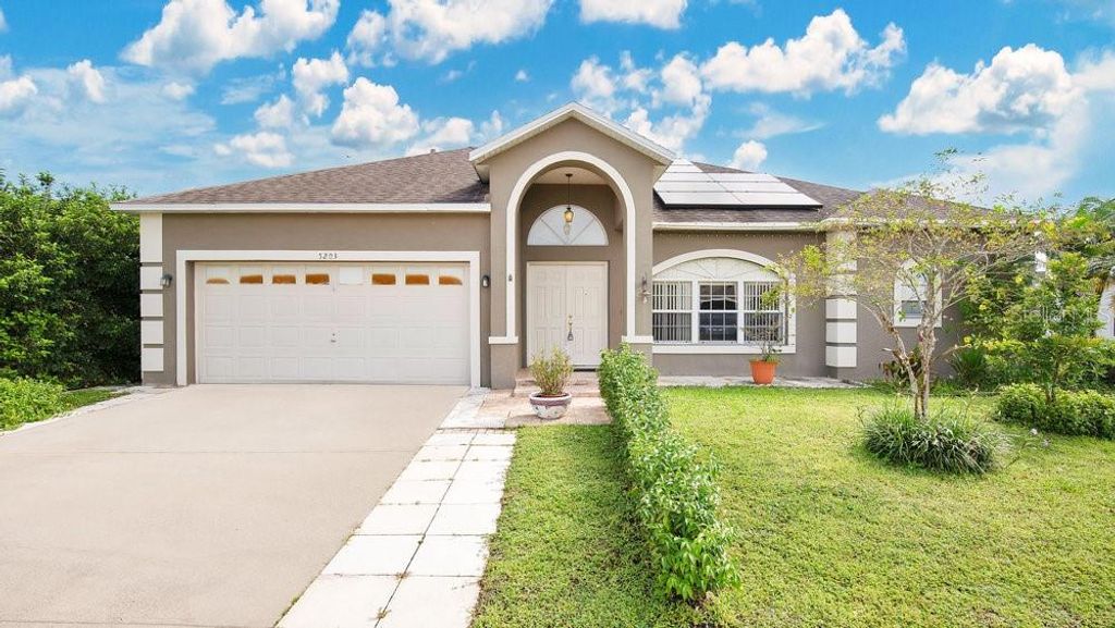 Photo of 5203 Jasmine Trace Lane, Kissimmee, FL 34758 (MLS # O6403135)