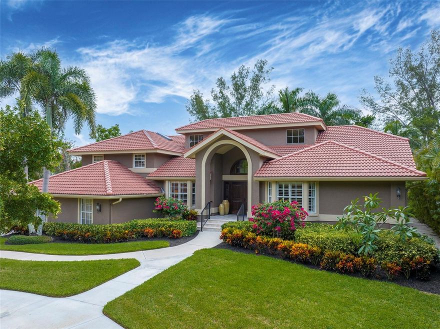 Welcome to your canal front oasis on Longboat Key. A boater’s waterfront paradise; nestled on one of the largest and most coveted  lots (24,498 sq ft) in the highly desirable Dream Island community. The perfect balance of privacy, waterfront amenities with a casual and modern open floor plan (with almost all living on one story). Located on a wide canal, just 5 minutes to the intercoastal, 10 minutes to Sarasota Bay and 12-15 minutes to the Gulf of Mexico. Launch a kayak directly into the water from your backyard. There are many boat size possibilities with a 20,000 lb. lift. The oversized Trex dock offers seating to watch the sun begin to set in the western sky while you’re cleaning the fish you’ve just caught. Deliver the just caught bounty to your new Blaze grill in the summer kitchen on the pool deck. It doesn’t get better than this. The white sandy beach that Longboat Key is famous for is just minutes away. You can feel the solid masonry construction.  It stands out due to being built on a raised lot with just 3 steps to enter. Lush tropical landscaping creates a welcoming ambiance and is cared for by a well on the property. Upon entering the foyer, you are greeted by an open, flowing layout, top quality manufactured wood flooring throughout, and soaring ceilings. When you enter this home, it truly offers the Wow factor and is a Must See. The home is designed to maximize natural light with sliders, large/transom windows, and French doors offering picturesque views of the elevated pool and lush backyard. The gourmet chef's kitchen boasts top-of-the-line appliances, including a Sub-Zero refrigerator, wine cooler, Viking 6-burner gas stove, Bosch dishwasher, walk-in pantry, and separate wine/dry bar making it a culinary enthusiast's dream. The butcher-block center island, white cabinetry, and extended granite countertop with bar seating provide plenty of storage and the perfect setting for today’s entertaining style. The family room and dining room boast a wall of impact windows that open to the paver terrace and pool, creating a seamless transition from indoor to outdoor living. The family room also includes a charming fireplace. There are four divided bedrooms, each with its own ensuite bathroom for ultimate comfort and privacy. The 5th dual-purpose room acts as a den/office or 5th bedroom. One of the guest suites is located up a short flight of stairs and has separate access from the outside. The primary suite is a true retreat, with picturesque views through the windows and French doors leading to the patio. Relax in the spa-like haven of the primary bathroom, which features a spacious walk-in shower, dual vanities, and walk-in closet. The expansive outdoor area is an extraordinary tropical oasis, with a heated pool, outdoor kitchen, and large backyard filled with flourishing mature trees. The pool's unique elevated design creates a striking focal point and provides a treehouse feel. The absence of a seawall enhances the property's natural appeal. Perks include a 10x15 laundry room/craft room with a plethora of cabinets and storage, hurricane-impact windows around the pool deck, and a 3-car garage with plenty of room for all your water toys. This home offers so much and can easily be your new Florida permanent home or your weekend Beach house for entertaining Family and Friends. Longboat Key will be welcoming the new world-renowned St. Regis Hotel when construction is complete next year.