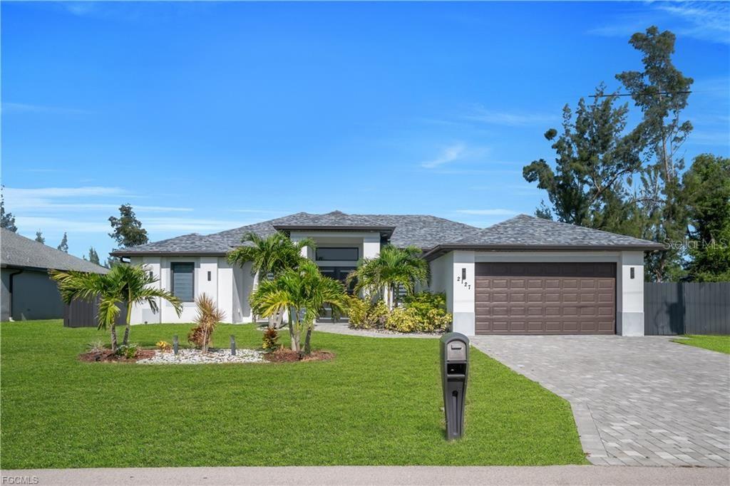 Photo of 2127 SW 17th Pl, Cape Coral, FL 33991 (MLS # TB8554230)