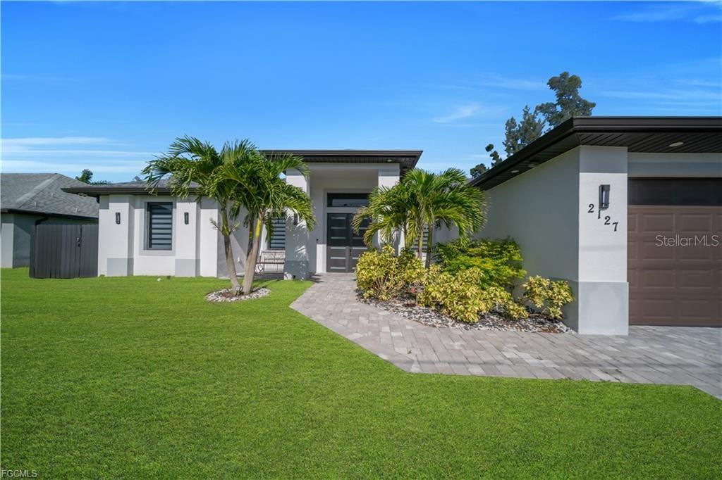 Photo of 2127 SW 17th Pl, Cape Coral, FL 33991 (MLS # TB8554230)