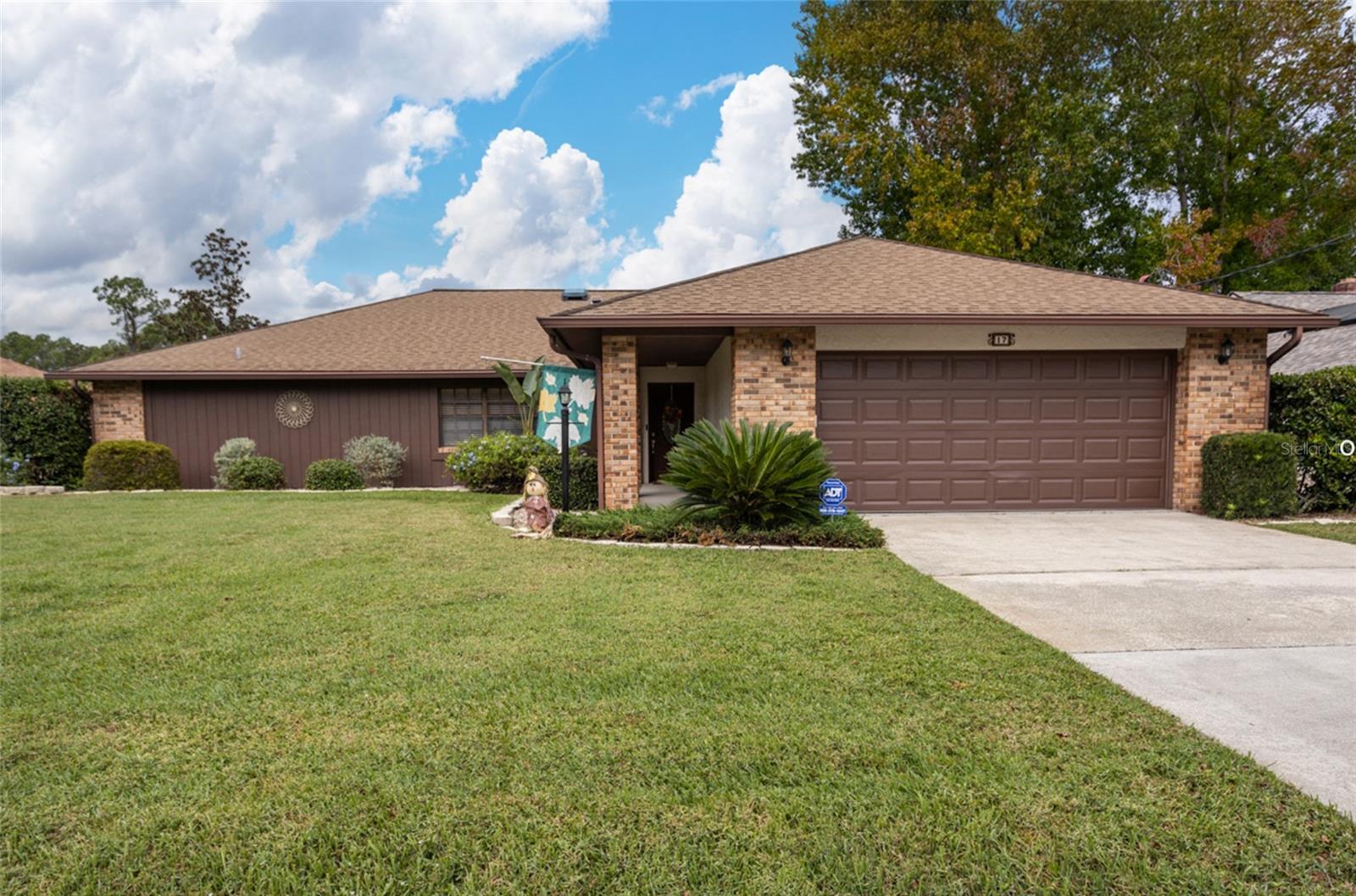 One or more photo(s) has been virtually staged. Great curb appeal welcomes you to this beautifully maintained home, surrounded by lush landscaping, mature vegetation, and vibrant green grass. Stone accents and an inviting front door create a warm first impression.
Step inside to a spacious living room that flows seamlessly into the family room and formal dining area. With 2,035 sq. ft. of living space, the home offers a thoughtful split floor plan providing added privacy for the bedrooms.
The kitchen features newer stainless steel appliances, a convenient breakfast bar, and an eat-in area—plus ample cabinetry for extra storage.
Enjoy the outdoors from your 10' x 25' screened lanai, complete with a tiled floor for easy maintenance and overlooking a private backyard enhanced by partial fencing and mature hedges.
Built with durable block and stucco construction, this home has been well cared for by the original owners. While it may benefit from some modern updates, it remains a solid, well-maintained property. A 5-Year Roof Life Certification Letter is included for added peace of mind.