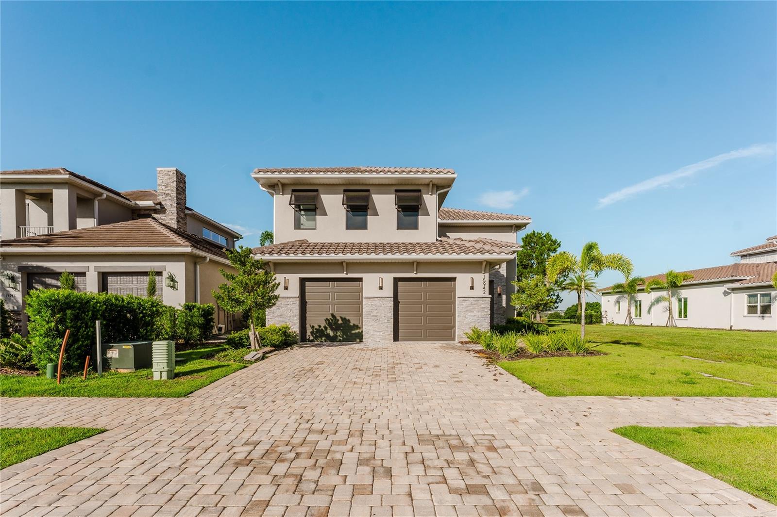 STUNNING ESTATE IN BELLA COLLINA - Welcome to the exquisite Milos plan by Davila Homes in the exclusive, guard-gated Bella?Collina golf community. This brand-new, architect-designed residence blends modern elegance with serene natural surroundings, offering a luxurious lifestyle just minutes from Orlando. This 4-bedroom, 4.5-bath modern estate features an open-concept layout with soaring ceilings, a gourmet kitchen with walk-in pantry, and an elegant great room with fireplace. The luxurious primary suite offers a private balcony with golf course views, a spa-style bathroom, and oversized custom closet. Additional highlights include an office, ensuite guest rooms, and premium finishes throughout. Enjoy the Florida lifestyle with a resort-style pool, spa, and outdoor kitchen. Residents enjoy 24/7 guard-gated security, an 18-hole championship golf course, tennis courts, fitness center, and clubhouse. This home blends luxury, comfort, and prime location—just minutes from Montverde Academy and the attractions of Central Florida.