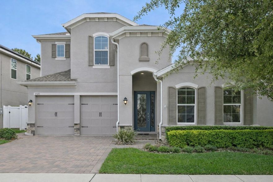Located in Winding Bay in Winter Garden, this move-in ready home for sale near Walt Disney World offers a rare combination of privacy, functionality, and luxury. Positioned on one of the best CONSERVATION LOTS in the community with NO REAR NEIGHBORS, this home delivers peaceful green space views and a truly private setting that’s increasingly hard to find. Built in 2021, this K. Hovnanian Tompkins model with bonus features a highly desirable open-concept floor plan with a DOWNSTAIRS PRIMARY suite, Jack-and-Jill bedrooms ideal for multigenerational living, and a DEDICATED HOME OFFICE - a layout that stands out among Horizon West homes for sale. The upgraded kitchen anchors the home with double ovens, cooktop with hood vent, coffee bar, wine fridge, oversized pantry with custom shelving, and extended counter space, all flowing seamlessly into the spacious main living area designed for entertaining. Interior highlights include CUSTOM CLOSET SYSTEMS throughout every room, plantation shutters and beautiful window treatments, WATER SOFTENER, and epoxy-coated garage flooring. Upstairs offers a LARGE LOFT/BONUS ROOM, full bedroom, and full bathroom, providing flexible space for guests, media, or additional living. Homes with this level of privacy, layout, and location in Horizon West are becoming increasingly difficult to find. Step outside to a screened-in lanai overlooking tranquil conservation, FULLY FENCED  and EXTENDED PAVER PATIO creating a private, resort-style outdoor setting designed for both entertaining and quiet everyday living, while subtle exterior upgrades like built-in front holiday lighting add convenience. Located just minutes from Hamlin Town Center, Flamingo Crossings, top-rated schools, and major highways including 429, residents enjoy access to community amenities including a pool, playground, and dog park, along with Disney fireworks and Space Coast rocket launch views from within the community. With LOW HOA dues and NO CDD, this home offers both lifestyle and long-term value. Opportunities like this in Winter Garden, especially in the Horizon West area, continue to see strong demand, making this one of the best opportunities currently available.