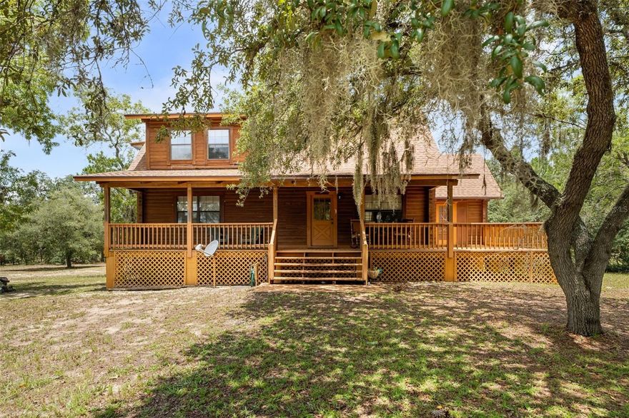 Discover this unique 5-acre property featuring a stunning custom log cabin in the heart of Williston, one of Florida’s most sought-after equestrian communities. Inside, the home offers rustic charm with soaring vaulted ceilings, an open-concept layout, and warm natural finishes that create the perfect blend of comfort and character. The acreage is open and ready to be tailored to your needs, whether that’s fencing for horses, building barns, or creating your dream riding arena. With plenty of space and options, this property is a blank canvas for equestrian or country living. Located just minutes from Black Prong Resort and a short drive from the world-renowned World Equestrian Center, this is a rare opportunity to enjoy peaceful country living while being at the center of Florida’s thriving horse community. This stunning 5-bedroom, 2-bath log cabin home offers over 1,800 sq ft of heated and cooled living space, plus an additional 1,000+ sq ft in the finished basement. The master suite is a private retreat, located on the upper level and featuring a large walk-in closet, ensuite bath, and private balcony overlooking the serene surroundings. Two bedrooms and a full bath are conveniently located on the main floor, while the fully finished basement includes two additional bedrooms, a dedicated office space, and laundry facilities. Enjoy energy efficiency with a tankless water heater, plus peace of mind with recent upgrades including a new roof in 2022 and a brand-new A/C unit. Convenient to Gainesville, Ocala, and nearby amenities. Schedule your private showing today! ** Boundary lines are approximate, not an actual survey. Information is deemed reliable but not guaranteed; buyers should perform their own due diligence to confirm all property details.**