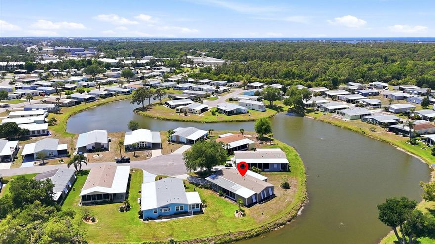 A serene lake view enhances this nicely maintained, 2-bedroom, 2-bathroom home in Tangerine Woods. This highly sought after, over 55 community, is an active and friendly place to live! For your leisurely pleasure, this community provides you with a large heated pool and clubhouse, an exercise room and library, tennis and pickleball courts, walking trails, shuffleboard and so much more! This turn-key furnished home, tucked away on a quiet cul-de-sac, has ceramic tile and carpeted floors, which offset the light and bright living, dining, and family room settings. Your front door entry welcomes you to the open, airy, and neatly decorated living and dining rooms. The spacious kitchen has an abundance of counter space and cupboards, breakfast bar, pantry, cooktop and oven, and is a chef's delight. The large beautifully furnished master bedroom, is enhanced with its wonderfully remodeled ensuite bathroom and large walk-in closet. The guest bedroom includes a barn door entry guest bathroom that has been updated and includes a tub and shower. A family room, with a built-in for your TV and media equipment, is just perfect for entertaining your guests. The screen enclosed lanai just off the family room, boasts a tranquil lake view, and offers you a comfortable second space for outdoor enjoyment and a place to unwind and relax. Off the lanai is a patio, which is ideal for your outdoor grilling. For peace of mind, this home has a new roof in 2022, new siding and new windows, and located in an X Flood Zone. Space galore is the perfect description of this home, that won't last long. Tangerine Woods is located just minutes from the quaint locally owned shops & restaurants of historic Dearborn Street, world class fishing, and many golf courses. This home offers an ideal Florida lifestyle. Schedule your showing today!