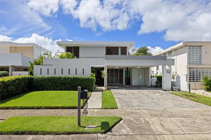 Discover the perfect blend of comfort, nature, and coastal living in this charming home located in the gated community of Villamar, walking distance from Isla Verde Beach and minutes away from the airport. This property features 4 bedrooms and 3 full bathrooms, sitting on a 450 square meter lot with 2,358 square feet of living space. The home offers a serene outdoor area surrounded by lush tropical vegetation, a refreshing pool, and an uncovered terrace ideal for relaxing or entertaining guests. Fully equipped with appliances, a generator, and a water cistern and includes a two-car garage. Prime location near restaurants, shops, and grocery stores. Experience island living at its finest in this unique Villamar residence. Airbnb and Short Term rentals allowed.