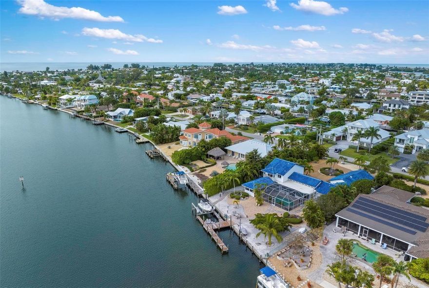 PRICE REDUCTION!!! - BOATER'S PARADISE IN KEY ROYALE! Showcasing dramatic water views from every room, this spacious 4-bedroom, 5-bathroom, 3-car garage home is located in the highly coveted waterfront community of Key Royale. A boater’s dream, this well-maintained property offers a long dock with a 16,000-lb. boat lift and spans 105 feet along a deep-water canal, offering direct access to the Intracoastal Waterway, Tampa Bay, Gulf of Mexico and beyond. Encompassing 3,100 square feet, the home features an expansive open floor plan with high ceilings in the main living area and four en-suite bedrooms, providing plenty of room for entertaining and accommodating overnight guests. Boasting a desirable southern exposure, the waterfront outdoor living space is perfect for savoring spectacular sunrises, cooking in the outdoor kitchen, lounging by the pool deck or relaxing in the heated pool and spa while watching playful dolphins. Key Royale residents can opt to join the private Key Royale Golf Club, featuring the island’s only golf course, along with dining and social activities. Anna Maria Island’s beautiful beaches and various points of interest are just a golf cart ride away, and nightly sunset cruises to the open waters with no bridges are easily accessible from your backyard. Call today for your private showing.