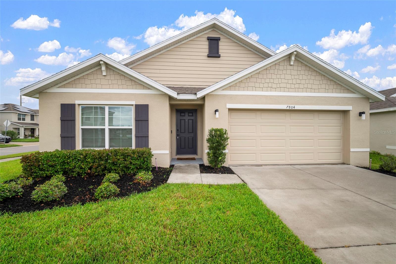 This modern 4-bedroom, 2-bathroom home sits on a spacious corner lot, offering privacy and great curb appeal. Inside, enjoy an open floor plan perfect for both relaxing and entertaining. The chef’s kitchen features granite countertops, a large island, plenty of cabinetry, a walk-in pantry, and stainless steel appliances. The private primary suite includes a luxurious ensuite with dual sinks and two walk-in closets. The three additional bedrooms are generously sized with ample closet space and share a stylish bathroom with a tub/shower combo.
Outdoor living is a breeze with a covered back porch and fenced patio, ideal for coffee, relaxation, or gatherings. The community offers a clubhouse, resort-style pool, playground, dog park, and more. Plus, HOA fees cover high-speed internet, Wi-Fi, cable, and smart solar-powered streetlights. Conveniently located off US-301, you're just minutes from Orlando, Tampa, shopping, dining, and major medical facilities.