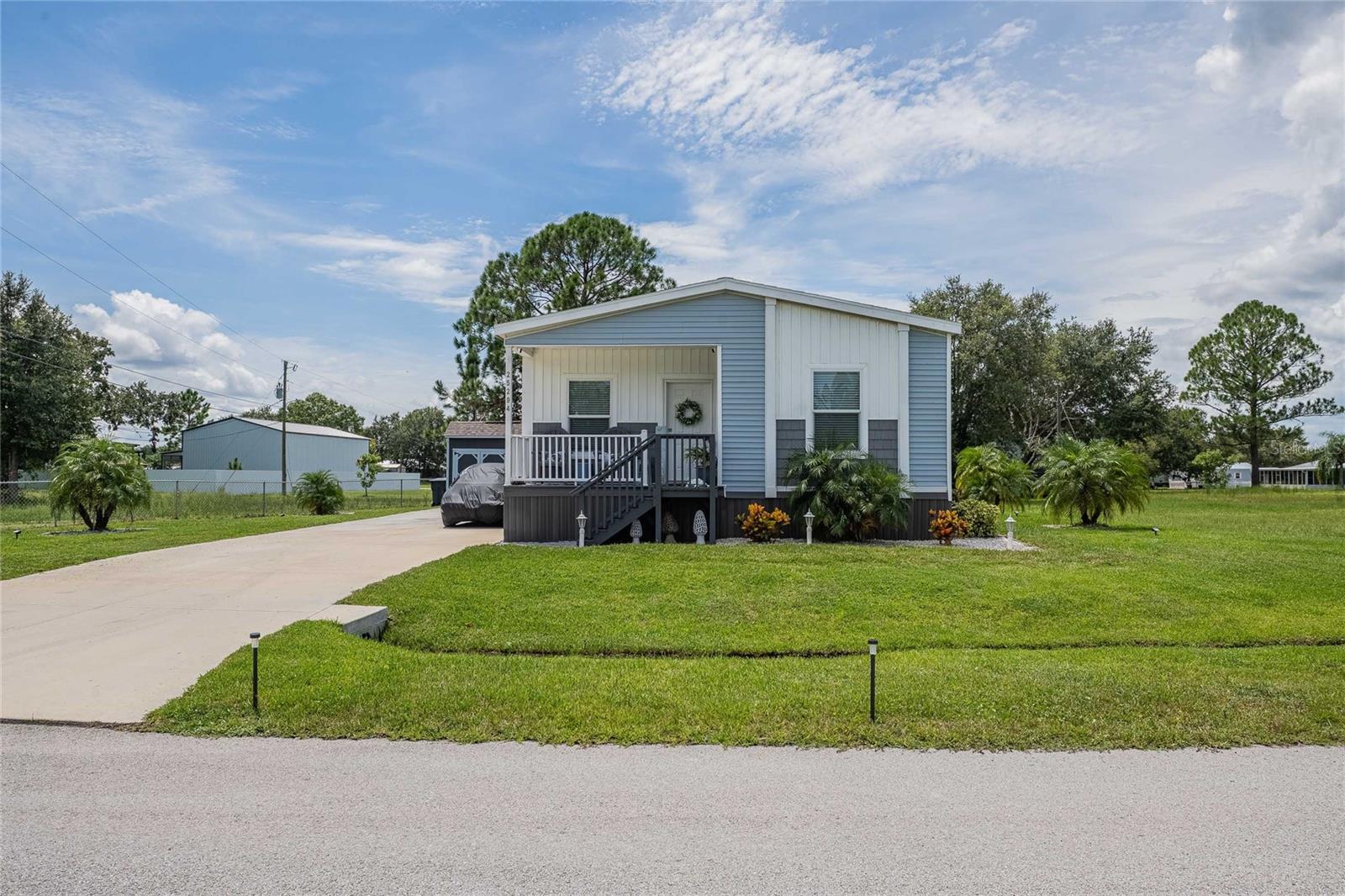 Modern Country Living in River Ranch
Built in 2023, this 2-bedroom, 2-bath manufactured home with an additional den offers modern comfort and style in a serene country setting. The open-concept layout flows seamlessly from the kitchen to the dining and living areas, perfect for entertaining and everyday living. The split floor plan provides privacy, with the master suite featuring a spa-like ensuite bath with dual vanities and a walk-in shower.
Enjoy the convenience of an inside laundry room and step outside to your own private backyard oasis. Fully fenced and thoughtfully designed, it features two covered areas for relaxing or hosting gatherings, plus a storage shed for all your outdoor needs.
Nestled in the sought-after River Ranch area, this home delivers the best of both worlds—peaceful country living with resort-style amenities nearby. Explore trail riding with ATVs, boating and fishing at the marina, or join the River Ranch Hunt Club. Just a golf cart ride away, Westgate River Ranch Resort offers endless fun: a live rodeo every Saturday, family-friendly saloon, brand-new waterpark, adventure park, skeet and bow shooting, airboat rides, riverboat cruises, hayrides, and more! Dine at local favorites like River Ranch Chop House, Smokehouse Grill, and the Pizza Shop, or grab essentials at the general store.
All of this comes with NO HOA or CDD fees—just pure freedom to enjoy the lifestyle you’ve been dreaming of.
Whether you’re looking for a primary residence or to add to your investment portfolio, this home is an excellent choice. Use it as your own getaway and take advantage of short-term rental opportunities when you’re not there.