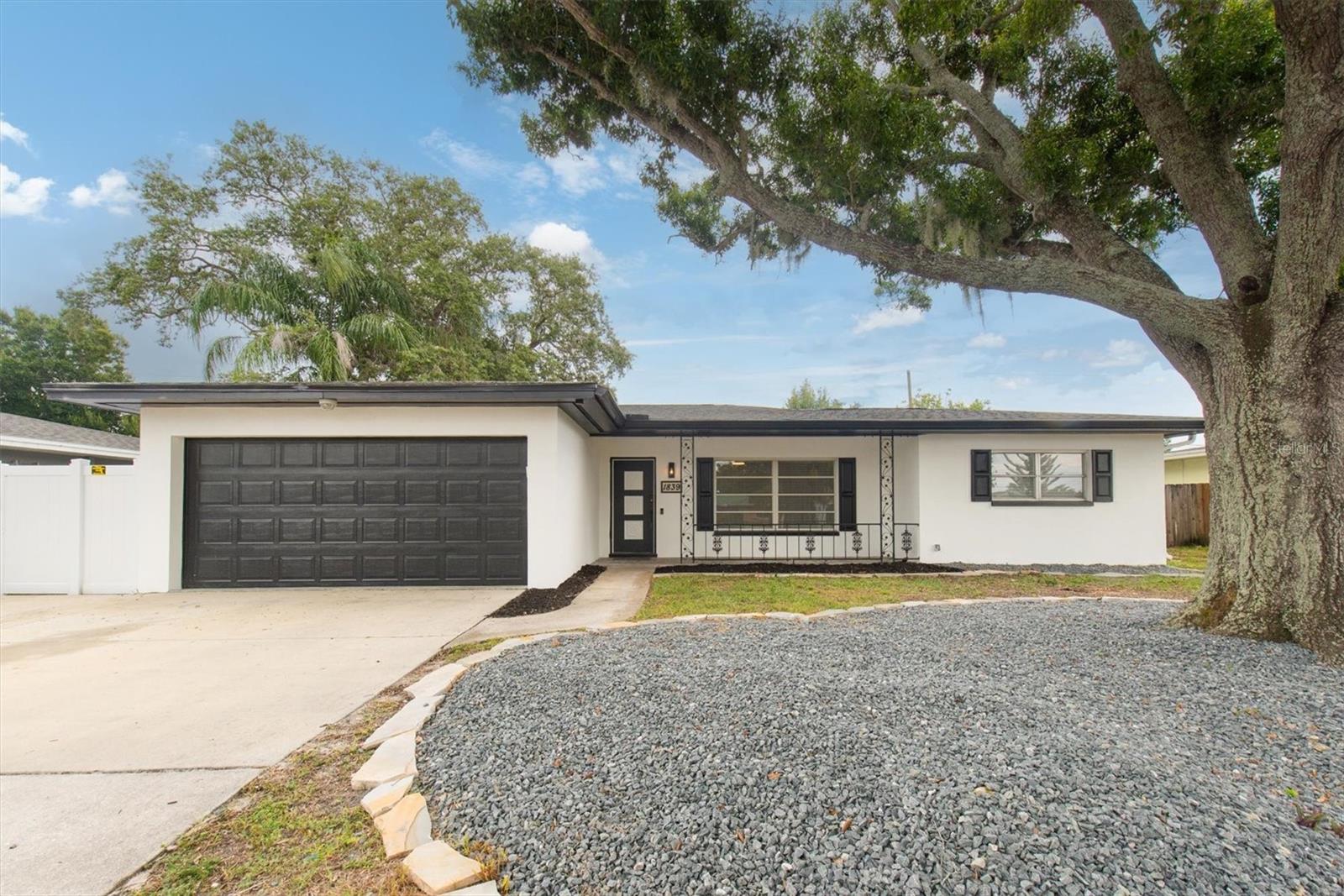 LOCATION LOCATION LOCATION! Welcome to this 3/2/2 BLOCK Construction home Located just outside of DUNEDIN, in the HEART of Clearwater in a HIGH AND DRY part of Clearwater in a NON-FLOOD Zone and NO EVAC Zone! So you don't have to worry about any Hurricanes or Flooding! And NO HOA or CDD Fees! This home has been Tastefully UPDATED, Featuring BRAND NEW Luxury Vinyl Flooring(2025) Brand New Crown-Molding(2025) Brand New WASHER AND DRYER(2025) All Brand New Designer Fans and Lights (2025) Brand New Custom Exterior and Interior Painting (2025) This home Features an OVERSIZED 2 CAR GARAGE with Brand New Epoxy Flooring (2025) A Brand-New VINYL FENCE (2025). New Water Heater (2022) Newer Roof(2019) and a Newer HVAC (2017) The kitchen has been Remodeled with NEW Stainless-Steel Appliances, New Sink, New Soft-Close Cabinetry, stylish Cabrera QUARTZ Countertops, enhanced by white subway tiles. This Home Features a SPLIT FLOOR-PLAN that presents the Primary Bedroom on one side of the home for Maximum Privacy. This room is Spacious and features an Ensuite bathroom that has been Remodeled with a gorgeous porcelain tile walk-in shower, matching porcelain floor and a new vanity. This Home Features a Big SCREENED-IN Lanai and also an Open Porch offering lots of entertaining spots. This Home also Features a Big Backyard which is FULLY FENCED with 2 Gates and a Spot to park your BOAT, RV or TRAILER! A Big Storage Shed. This Home also Features a Front Porch with Brand New Tile Floors(2025) and a New Ring Door-Bell(2025). New Landscaping (2025) A BIG DRIVE WAY Featuring an EXTRA PARKING PAD for your BOAT/RV. This Prime Location conveniently located to airports, schools, restaurants and shopping! Only 5mins away from the New PICKLEBALL COURTS, The Pinellas Trail for Biking and Walking and Just a short drive from vibrant Downtown Dunedin, Honeymoon and Caladesi Island, Clearwater and Gulf Beaches! Don’t miss this opportunity to invest or live in this Quiet, tucked away neighborhood!