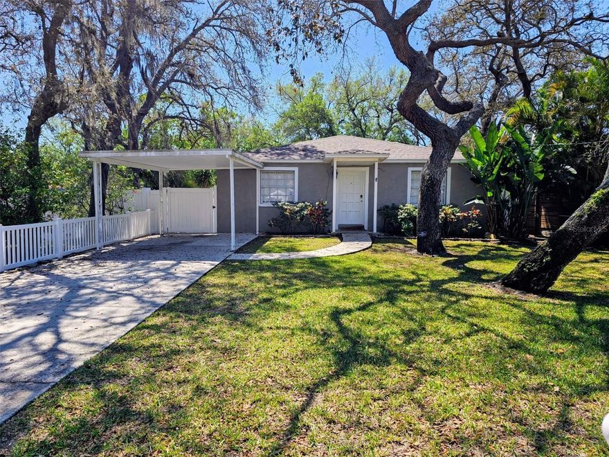 South Tampa-South Macdill house a Charming 3/2/1-carport, split plan, screened rear porch with spa, fenced large back yard, house is move-in condition, freshly painted, updated bathrooms and kitchen, wood flooring, large shed and a smaller one for yard tools.  Excellent location close to all of S Tampa areas. As you enter the front door to the left is the Primary Bedroom with updated bathroom, walk-in closet, the living room will afford expansive view from the very front to the back of the lanai, sliders have inserted blinds, kitchen has an island and breakfast area, pantry, a barn door can close off the secondary bedrooms and utility closet for additional privacy.  Excellent schools for all grades, lush landscape drip irrigation, worth taking a look at this one.