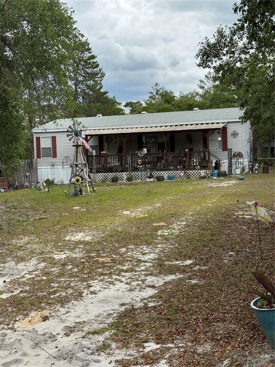 Looking for privacy in Silver Springs? This 3 bedroom 2 bath home situated on a double lot containing 0.56 acres is perfectly set back from the
road with beautiful vegetation and more! Walk up onto your HUGE front porch & enjoy the quiet afternoons, pull the shades down for extra
privacy as well!  A split floor plan is a great feature with a
large owners suite & oversized ensuite. The backyard is fenced up to the vegetation where no one can build behind you or to the left of you! A fun
patio with near the well house is perfect for entertaining, or sit on your back wooden deck! The large yard is ready for recreation, family
gatherings, or just a place to relax in the quiet & enjoy nature. Make your appt today to view!