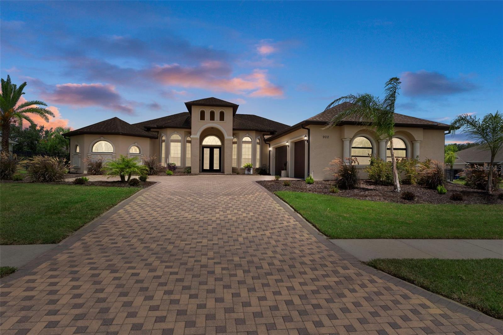 Exceptionally Elegant Pool home in the Villages at Avalon. This home features a versatile multi split 5 bed floor plan. Enjoy the 5th bedroom w/Bay Window Seating area as a great Media/Game room. Tray ceilings a/o Crown moulding, Surround Sound and Ceiling Fans throughout. Gourmet kitchen with Walk in Pantry, Wine Cooler, Island w/ Prep Sink. Great Room and Outdoor Fireplaces. Massive Primary Bed & Bathroom w/ Sitting Area, Walk-in-in closets, Dual vanities and Jetted Tub and Primary foyer to use a formal living or elegant entry to the Primary suite. Bedroom 3 with Carpet has boxed Luxury Vinyl should you choose. Tankless/Propane Hot water. Oversize Lanai with TV & Outdoor Kitchen hook ups. Salt pool with fountains, and a Fenced Back yard. Don’t miss the roomy garage. Close to the Suncoast Parkway for easy Tampa commute. NO Flood Zone, Low HOA. Close to Shopping, Florida’s Parks & Beaches and Medical.