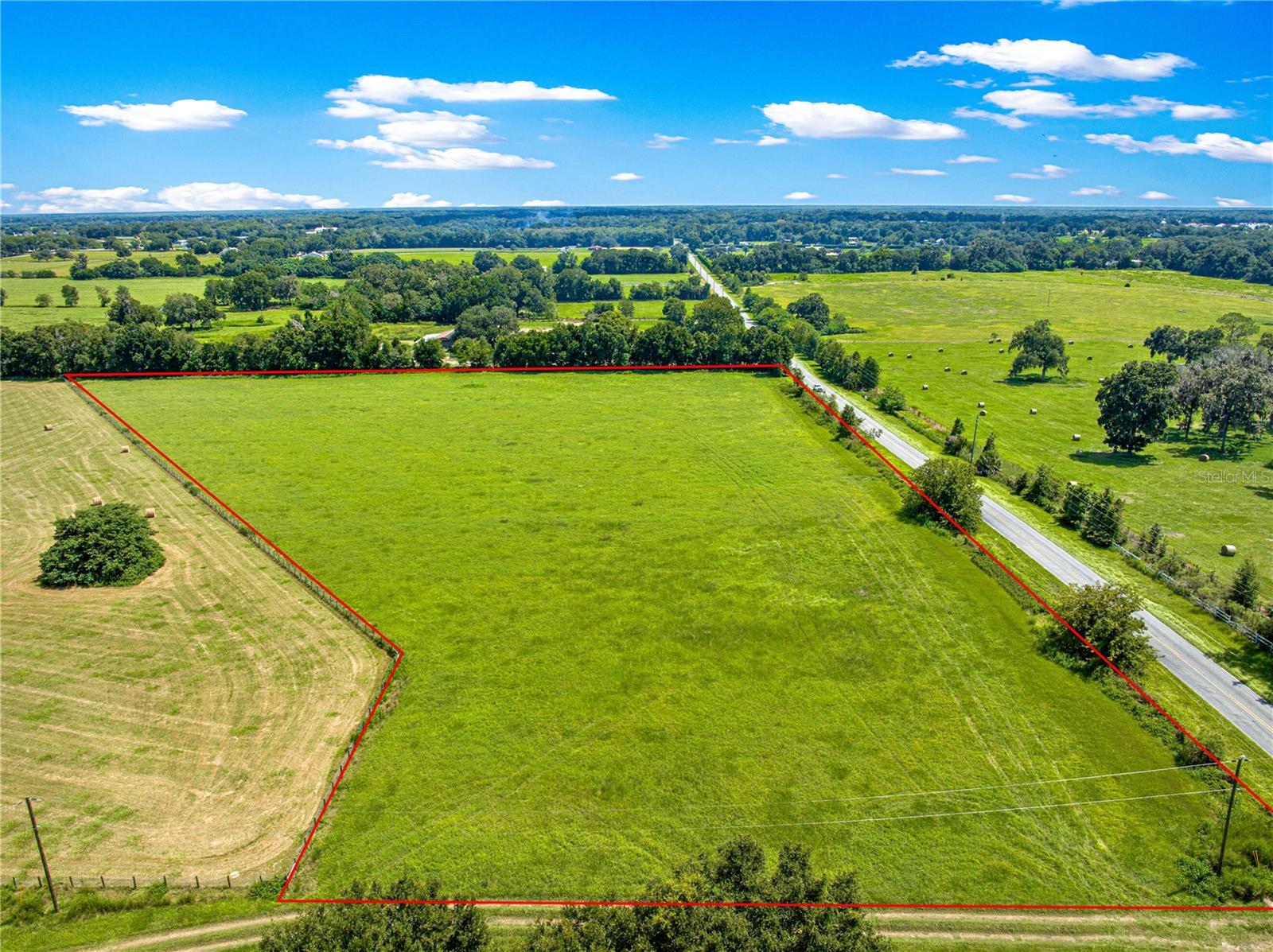 Welcome to Flyway Acres, a rare opportunity to own over 10 acres in the heart of Marion County—home to the world-renowned World Equestrian Center (WEC), the largest equestrian exhibition and training center in the world.
This prime location places you just 13 miles from WEC, minutes from Hidden Acres, RKC Dressage, Jumbolair, and Cardinal Equestrian Training Facility. You’ll also be 30 miles from the University of Florida & Shands Hospital, and only 90 miles from Orlando.
The property exudes rolling green pastures, mostly Coastal Bermuda grass with approximately 10 acres in a Coastal/Bahia mix—perfect for horses or livestock. Builders and bulk lot combinations are available, with a minimum building requirement of 2,400 sq. ft.. Best of all, Barndominiums are allowed and welcomed, giving you flexibility to design your dream equestrian estate.
A builder is available for consultations, so bring your vision to life at Flyway Acres. Schedule a tour today before this rare offering is gone!