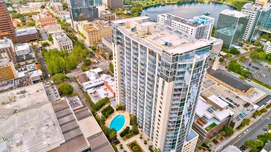 CORNER UNIT Soaring high above Downtown Orlando, at the premier highrise SOLAIRE AT THE PLAZA offering sweeping, unobstructed views of the City Beautiful. Floor-to-ceiling windows throughout showcase breathtaking city vistas and flood the home with natural light, creating an impressive arrival upon entry. This stunning 2-bedroom, 2-bath residence features an open-concept layout with a desirable split floor plan. The dark wood-grain flooring adds warmth and durability while perfectly complementing the modern aesthetic. The sleek kitchen is equipped with stainless steel appliances and a perfect view of the skyline while you prepare your favorite meal. Every space is thoughtfully designed to highlight the panoramic city views and is perfect for entertaining and sure to impress your guests. Solaire at the Plaza offers first-class amenities, including a stunning rooftop resort style pool, a fully equipped fitness center, and an elegant club room overlooking the pool. The newly upgraded facial recognition entry adds to the already top-notch high security at Solaire where you can rest easy knowing safety is #1. Located in the heart of a fully walkable downtown, you’re surrounded by premier dining, shopping, and entertainment. Just two blocks away are the Kia Center (Orlando Magic), Exploria Stadium (Orlando City Soccer), and the Dr. Phillips Center for the Performing Arts, where you can enjoy Broadway shows and world-class performances. With Lake Eola a short walk away, there is always something fun and exciting happening: Sunday market, fireworks, festivals, incredible Christmas decorations and so much more. Luxury high-rise living meets unbeatable downtown convenience in this exceptional corner unit aggressively priced to sell. Reaquaint yourself and fall in love with the new and improved SOLAIRE AT THE PLAZA where luxury, safety and affordability awaits you.