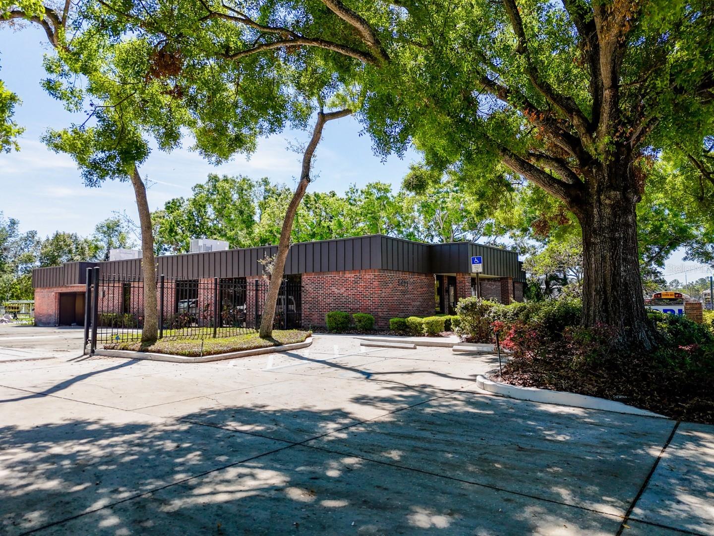 This 5,064 SF single-story office building sits on a spacious 0.72-acre lot and offers excellent functionality and long-term value. Originally built in 1984, the building has an effective age of 2007, reflecting updates and solid upkeep. The property features three HVAC systems (2007, 2020, and 2025), and a brand-new 2025 roof with a 50-year warranty, minimizing future capital expenses.
Secure and private, the entire lot is fenced and equipped with an electric gate. Ample parking with 26 marked spaces adds convenience for employees and visitors. Located just 2 miles from Hwy 301, 3.5 miles from I-75, and only 8 miles from Downtown Tampa, this site provides quick access to major transportation corridors and urban amenities.
Zoned for manufacturing (M), this versatile building offers opportunities for office, industrial, or flex space users. Priced to sell and ready for immediate occupancy or investment