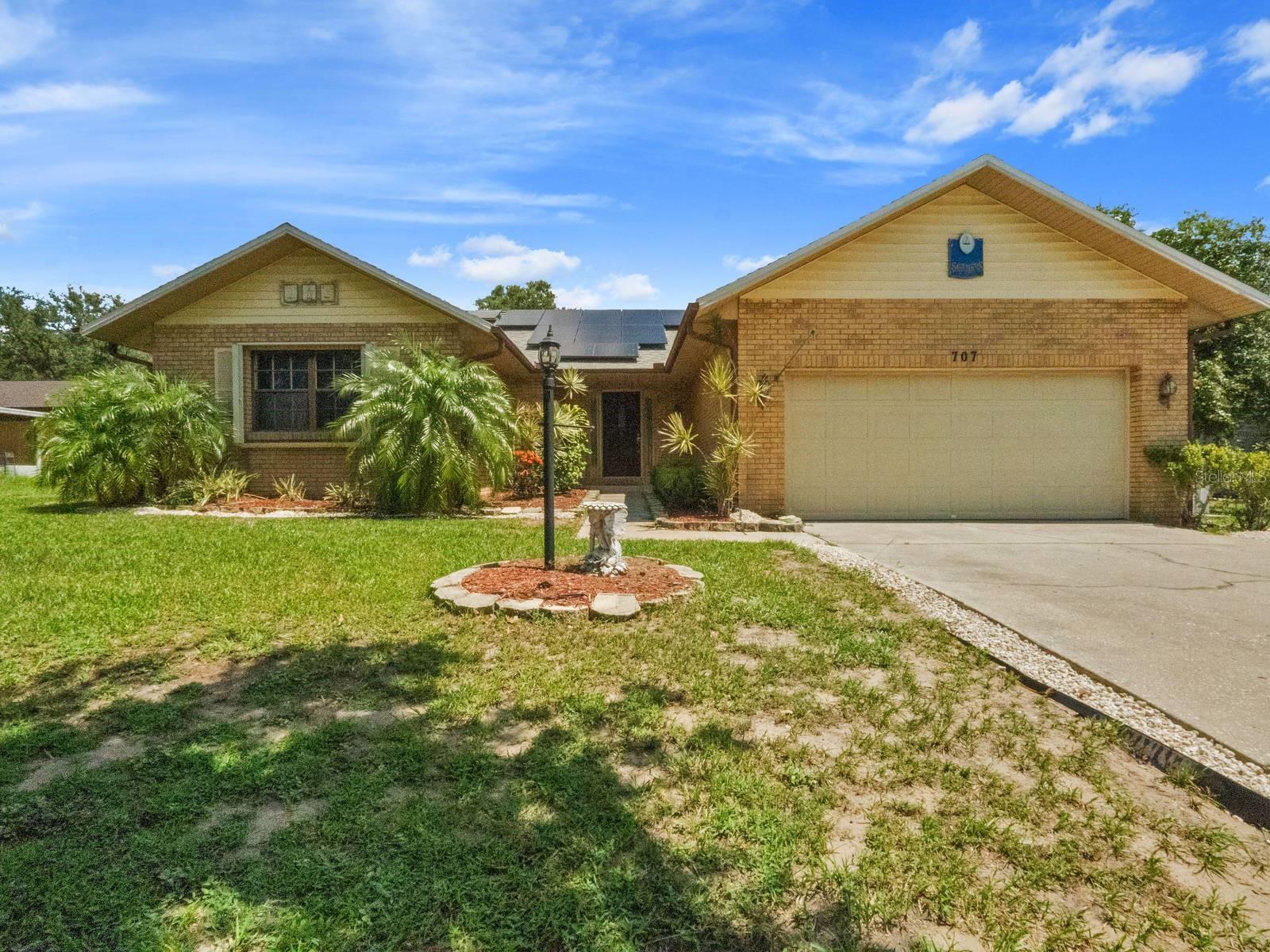 Fabulous property in the highly desirable community of Crown Pointe. This 2 Bedroom, 2 Bathroom Block Home situated on 1/3 of an acre. New Roof! New A/C! Upon entering your greeted with the spacious sunken living room featuring soaring ceilings and a masonry propane fireplace and ceramic tile. The living room flows into the dining room and kitchen. The kitchen boasts white cabinets, stainless steel appliances, and a trendy backsplash. Adjacent to the kitchen is the light, bright Florida Room which has lots of natural light and large screened windows. Perfect for entertaining with a standing bar which can convey. The master bedroom has a large walk-in closet, ceiling fan and is carpeted. The guest bedroom has a Murphy Bed, ceiling fan and is carpeted. The 2nd bathroom, kitchen and dining room have New Wood Floors. The backyard is completely fenced which is perfect for your 2 0r 4 legged friends and family. The New Wood Fence has a double gate on one side and a single gate on the other. Relax in the heated Jacuzzi hot tub or enjoy grilling on the patio. There is plenty of room to add a pool in the huge back yard. The shed has electricity and an A/C unit. The A/C was replaced in 2024 and included the air handler. All duct work was professionally cleaned. Conveniently located across the street from the trail leading you to Lake Wales and Lake Wales Park. Minutes to downtown, Bok Tower Gardens and so much more! Pride in ownership shows in this maliciously well-maintained home! Come and Enjoy your Best Life! Welcome Home!