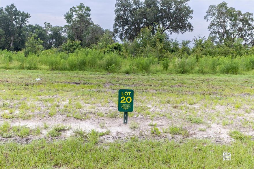 Experience luxury living infused with county charm in the exclusive, privately gated community of Oxford Preserve Estates.  With only 20 estate lots set on 5-8+ acre parcels of land, each is unique featuring pristine, wooded land highlighted by majestic native Live Oaks, graceful palmetto, and scrub oaks. Designed with both elegance and natural beauty in mind, all utilities are discreetly placed underground, preserving the serene landscape while offering modern convenience. There is no set timeframe for building your custom dream home, giving you the freedom to choose your own builder and craft a residence that perfectly suits your lifestyle. Public utilities are robust and reliable, including high-speed Spectrum internet and dependable SECO electric service, while private utilities such as well and septic systems are managed individually by each lot owner. Home designs are thoughtfully mandated to ensure spacious living, with one-story homes requiring a minimum of 2,400 square feet and two-story homes needing at least 1,800 square feet on the first floor. Adding to the appeal is an affordable HOA yearly assessment of less than $800, which helps maintain the community’s pristine condition. Ideally located, this neighborhood offers true Florida living at its finest, with the convenience of being less than a 10-minute drive from essential amenities including The Villages Charter School, Super Walmart, Publix, Costco, Chick-Fil-A, Lake Sumter Landing, Home Depot, Lowes, and churches.