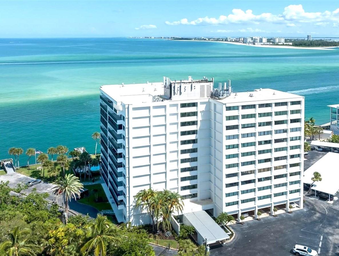 One or more photo(s) has been virtually staged. ONLY UNIT WITH DIRECT GULF VIEWS UNDER $600K. MOTIVATED SELLER! MAKE AN OFFER! (NEW A/C unit installed June, 2025). Exceptional value for a Gulf-front condo on Siesta Key! If you’re looking for a deal... this is the one! 2-bedroom, 2-bathroom condo nestled along the Gulf and Intracoastal Waterway of BIG PASS this condo offers everything you need for laid-back living. Open floor plan with split bedroom layout, ideal for privacy and comfort. Hurricane-rated impact windows and sliding glass doors to ensure peace of mind and showcase views of the Gulf waters. The kitchen is complete with solid wood cabinetry, granite countertops, and stainless-steel appliances. Freshly painted interior, 2024 updated light fixtures, and ceiling fans. Tile flooring throughout, and recently tiled guest shower. Relax and unwind on your HUGE balcony where you can watch sunrises and sunsets over the water. Resort-style amenities take your experience to the next level: Heated waterfront swimming pool, fishing dock, social dock, and new gas grills in the BBQ area. Completely remodeled fitness center with new equipment, remodeled club room, bike storage room and lockers for beach gear. The building has been completely updated from the roof top down to the landscaping and everything in between. Just TWO blocks from Siesta Key Village and beaches, easy access to shopping, dining, and entertainment. 24/7 security features and resident-only access.