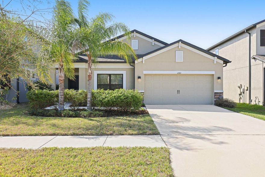 Welcome to this spacious and well-appointed home located in the sought-after Carlton Lakes community of Riverview, Florida. Offering 2,076 square feet of thoughtfully arranged living space, this 3-bedroom, 2-bathroom residence with a 2-car garage delivers comfort, functionality, and stylish finishes throughout.
Ceramic tile flooring extends through the main living areas, bathrooms, and laundry room, providing durability and easy maintenance, while soft carpeting in the living room and bedrooms creates inviting spaces for rest and relaxation. Just off the entry, a generous formal living room offers flexible space for entertaining or additional seating.
The kitchen serves as the centerpiece of the home, featuring rich espresso cabinetry, granite countertops, and a large center island with room for seating. A pantry closet adds convenient storage, and the layout opens seamlessly to the dinette and expansive family room, creating an ideal setting for everyday living and gatherings. Sliding glass doors bring in abundant natural light and lead to the covered rear patio and fully fenced backyard.
Designed with privacy in mind, the split-bedroom floor plan positions the primary suite at the rear of the home. This spacious retreat includes an en-suite bathroom with dual sinks, a walk-in shower, private water closet, linen storage, and a sizable walk-in closet. The two secondary bedrooms are located towards the front of the home and share a full bathroom with a tub/shower combination. Both bedrooms 2 & 3 are equipped with a ceiling fan for added comfort.
Residents of Carlton Lakes enjoy access to community amenities, including a pool and recreation center, and the location offers convenient proximity to shopping, dining, entertainment, and major roadways—making daily commutes and errands simple and efficient.