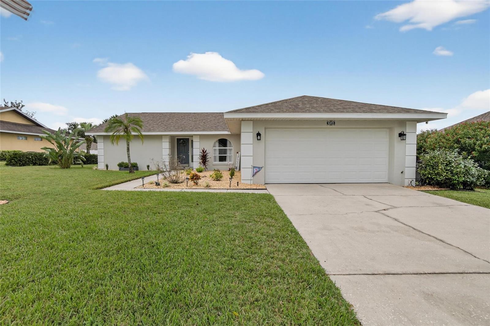 Welcome to this beautifully well-cared-for 2BR/2BA pool home with a 2-car garage in the peaceful and desirable community of Woodbury in Lakeland! Step inside to discover a bright, inviting layout with thoughtful updates throughout. The kitchen remodel (2024) features stylish new cabinets, granite countertops, GE & LG stainless steel appliances, and updated lighting, fans, and hardware. Additional 2024 upgrades include new vinyl flooring in the secondary bedroom and utility room, window tinting for comfort, new utility sink in the garage, updated toilets, porcelain countertop in the hall bath, rebuilt and re-screened pool cage, upgraded sprinkler system, and freshly pumped septic. In 2025, enjoy a complete primary bath renovation with resurfaced cabinets, new sinks and faucets, fresh paint, and a new tile-look shower insert, plus exterior paint and new landscaping with decorative rock. The pool deck, patio, and screened lanai were also repainted, and a third nail was added to the roof structure for potential insurance savings. Added bonuses include a hurricane-rated garage door, water softener filtration system, and a 2017 roof. Washer, dryer, and pool vacuum convey. Conveniently located near shopping, dining, medical centers, and I-4 for an easy commute to Tampa or Orlando!