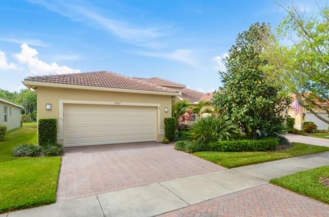 AVAILABLE FOR IMMEDIATE OCCUPANCY....Located in beautiful , lushly landscaped Valencia Lakes, come see why this light & bright 2 Bedroom/2 Bath villa is the perfect place to call "home". Nicely appointed with wood laminate flooring thruout. Primary ensuite with dual sinks & separate shower. Kitchen has upgraded cabinets & granite countertops; breakfast bar & dinette area; stainless steel appliances. Inside laundry. Spacious covered & screened lanai with a serene view of lake & wooded area. Two car garage. If staying active & making new friends is what you're looking for, there is no lack of things to do at Valencia Lakes! Relax by the resort style pool or swim laps in the lap pool. Stay in shape at the state-of-the-art exercise facility. Play games, cards, billiards or make art in the craft room. Join a club! Social Hall offers special events & entertainment. Pickleball, tennis & bocce are also options. Two mile exercise path around the neighborhood, too! Community garden & Dog park. Virtual gate entry. Come see why you'll enjoy living here! Unfurnished. Pictures shown with previous tenant furnishings. Call today...you can snooze when you move in! :) Pets & Golf carts welcome.